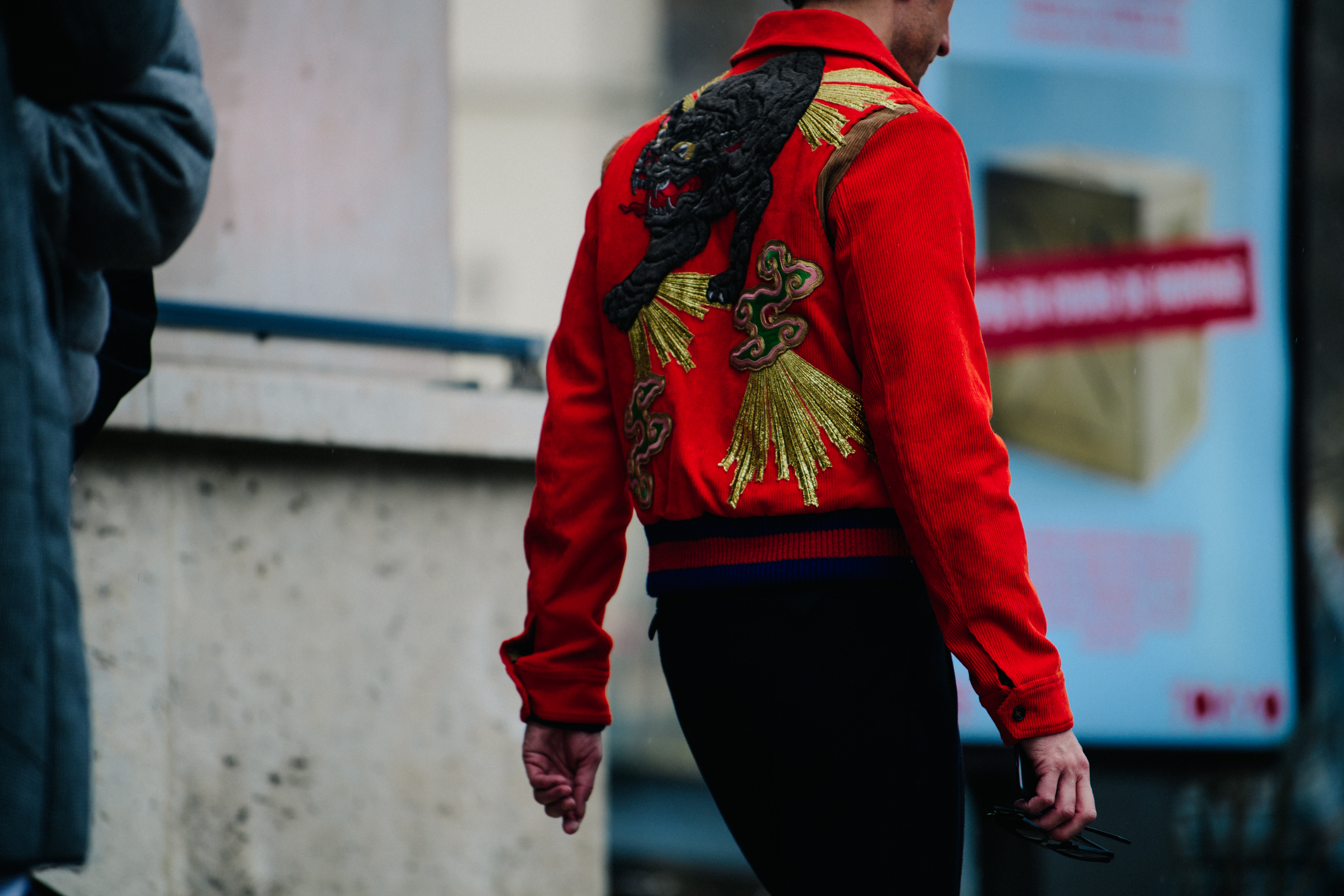 Man wearing Chinese dragon jacket