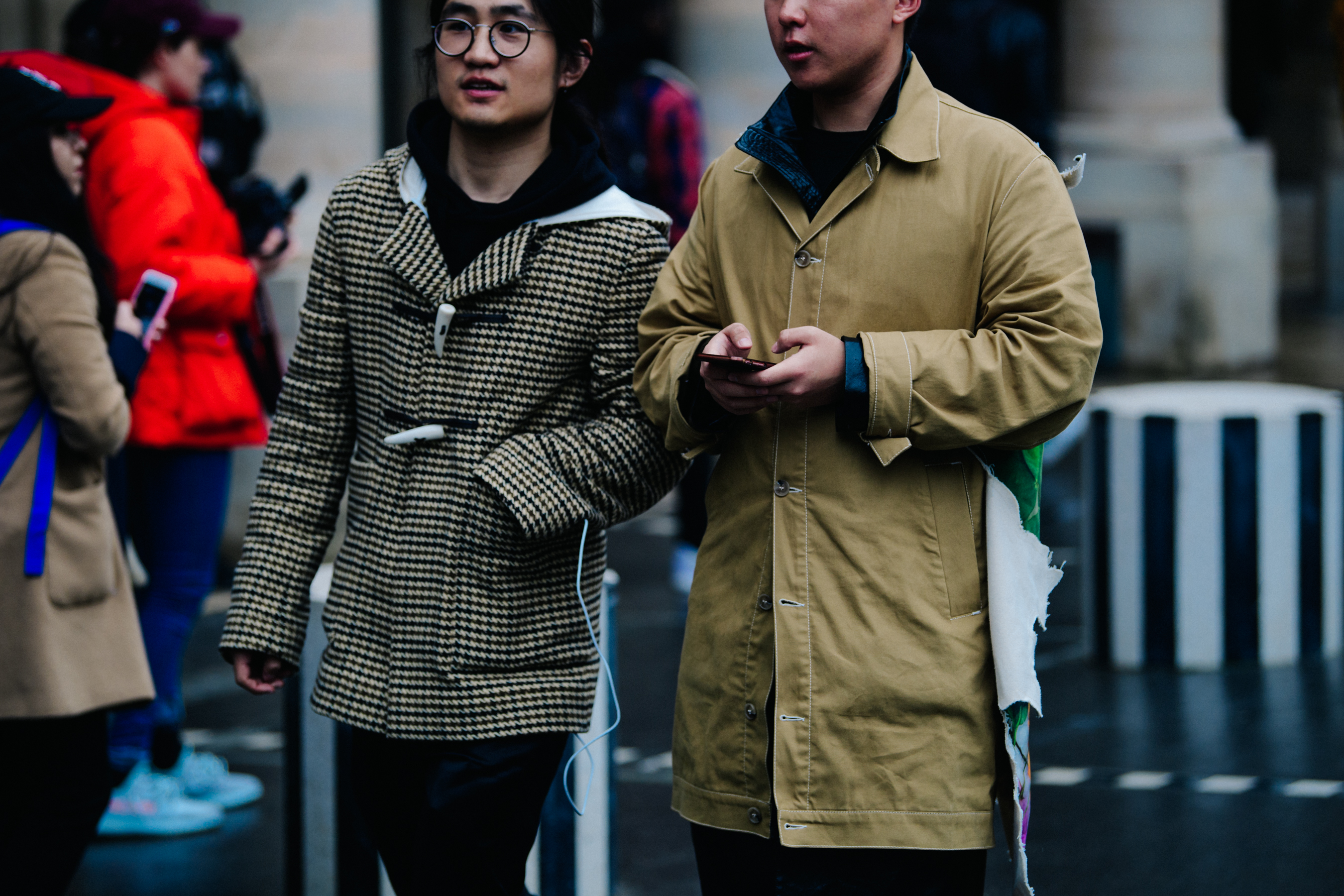 Two Asian men wearing tan jackets