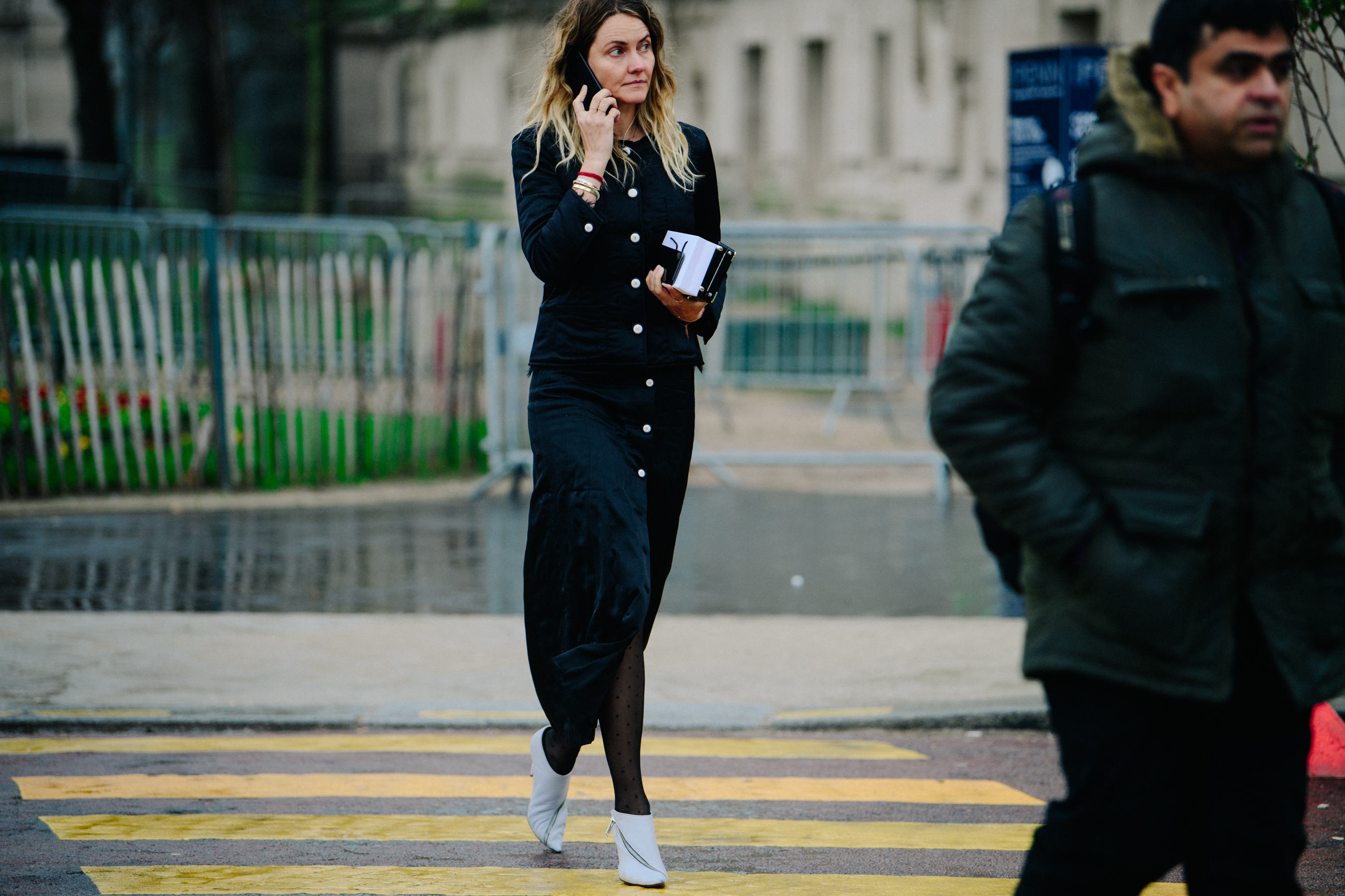 Woman wearing black skirt and jacket