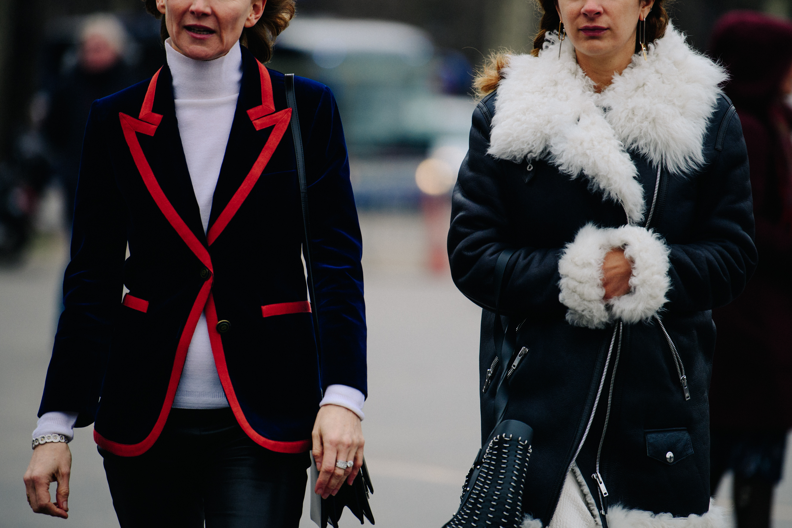 Two women wearing black jackets