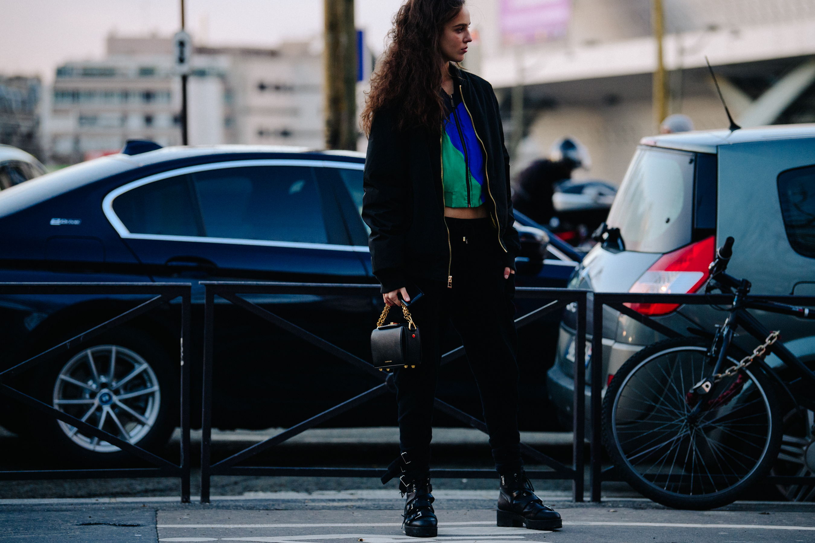 Model wearing black strapped boots