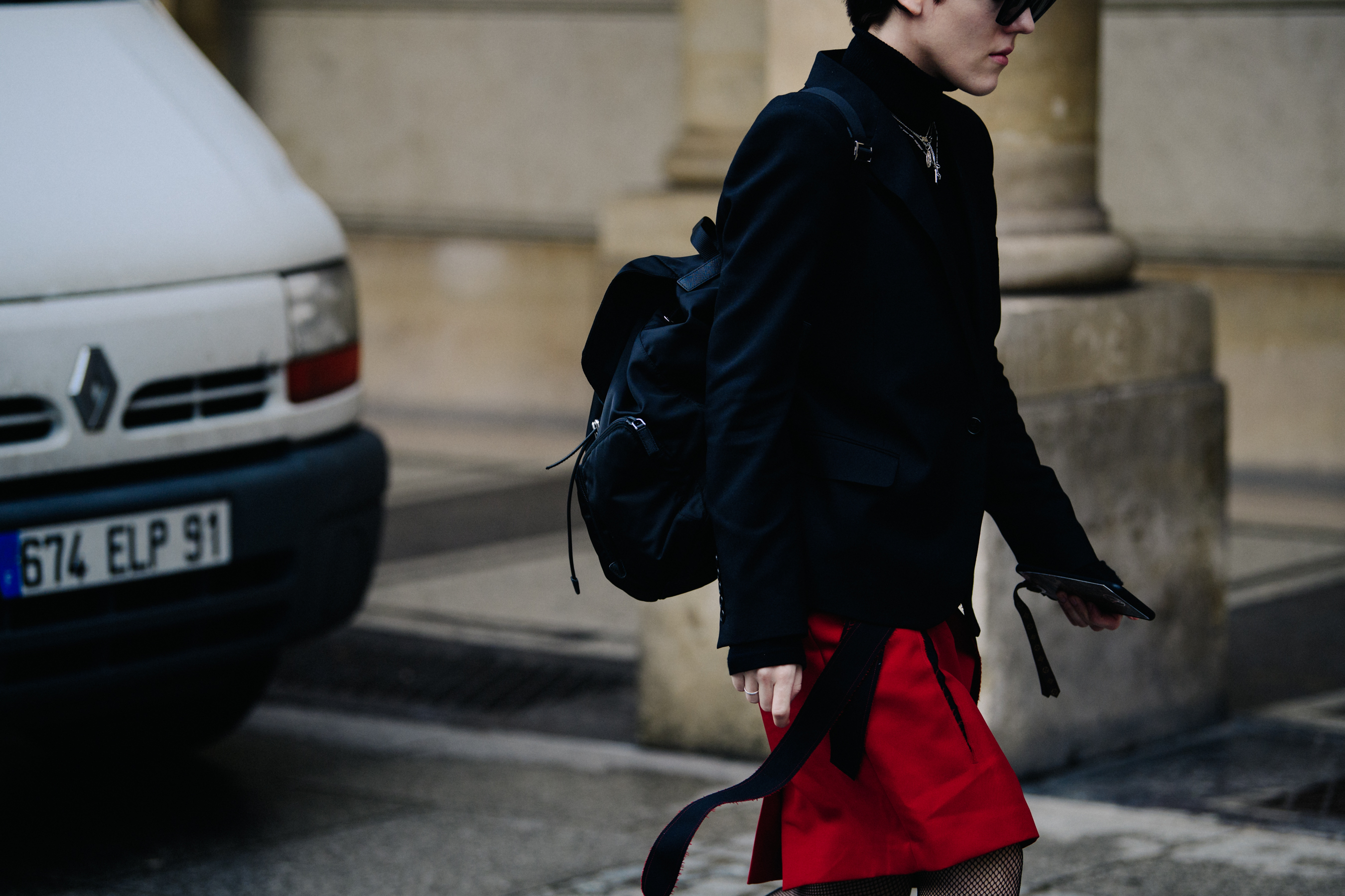 British editor wearing red skirt