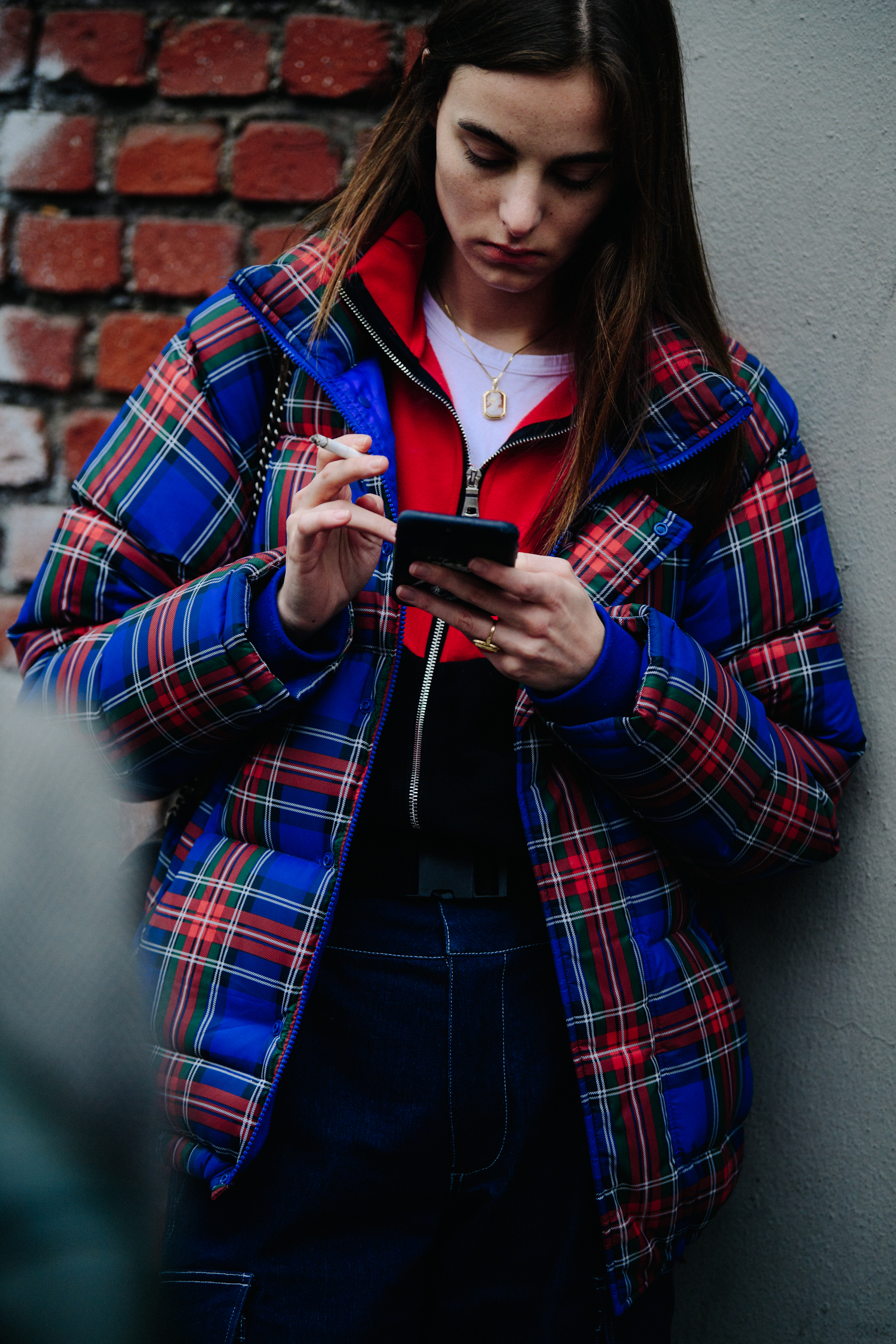 Dutch model wearing tartan pattern coat