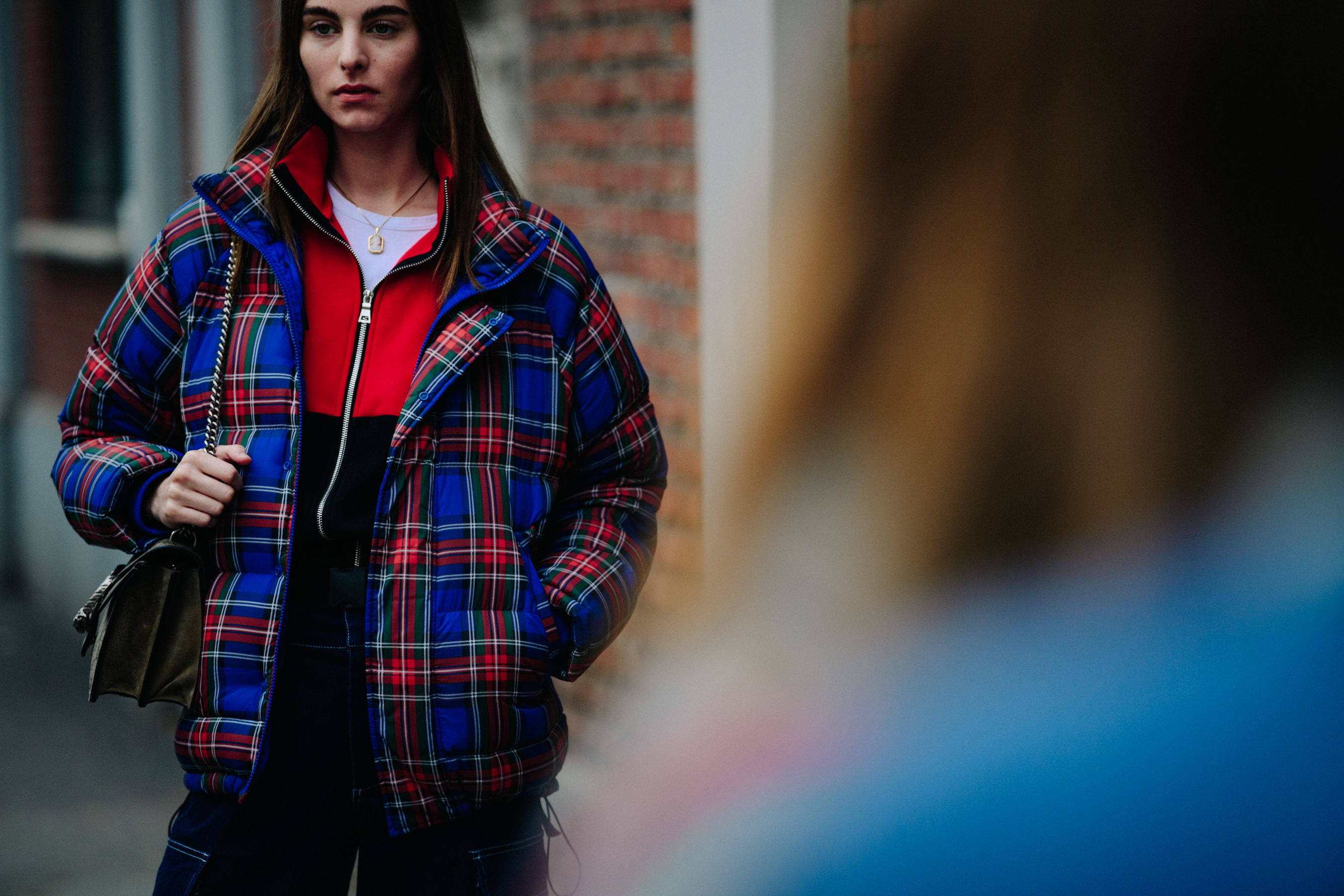 Dutch model wearing tartan pattern coat