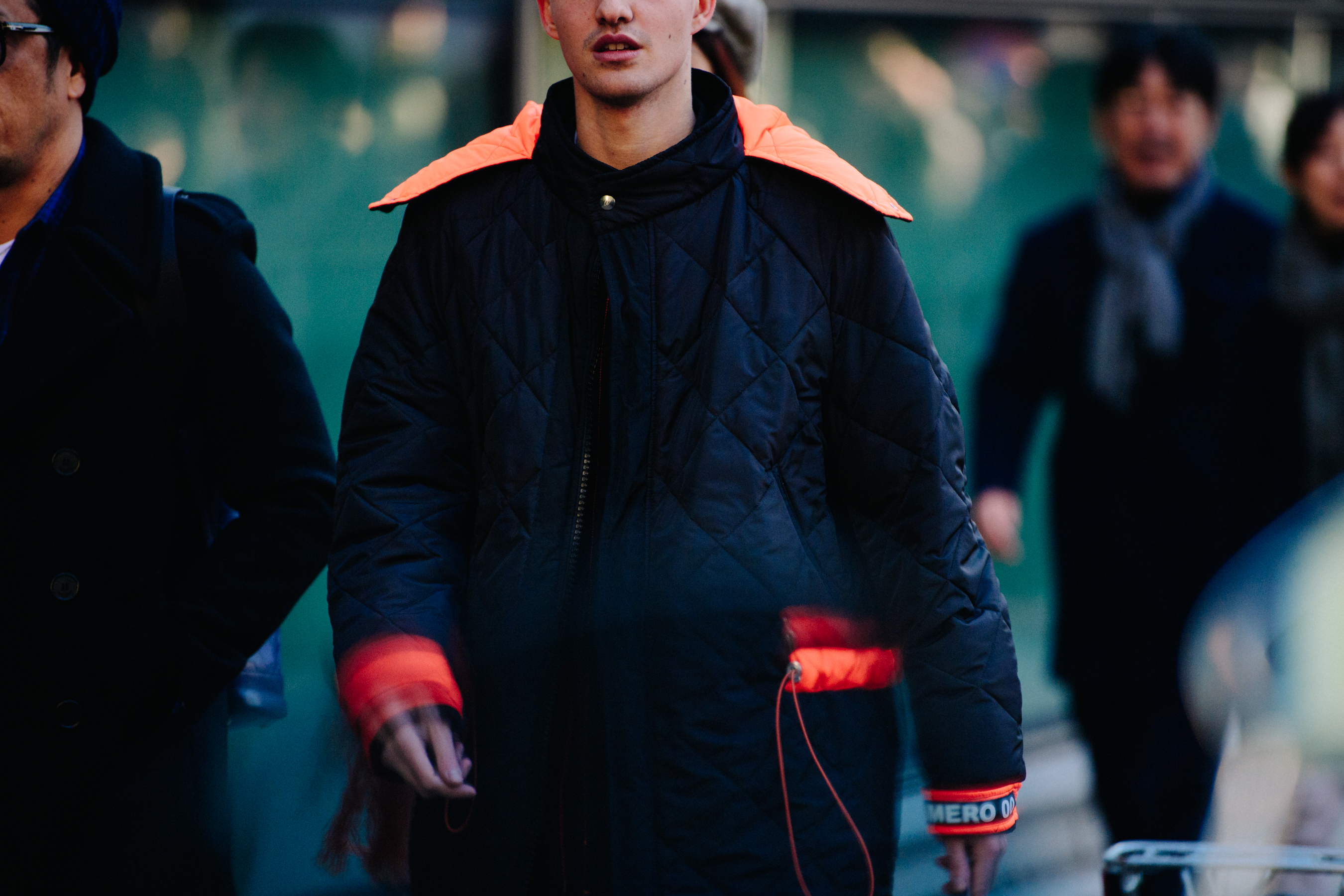 Man wearing quilted black jacket