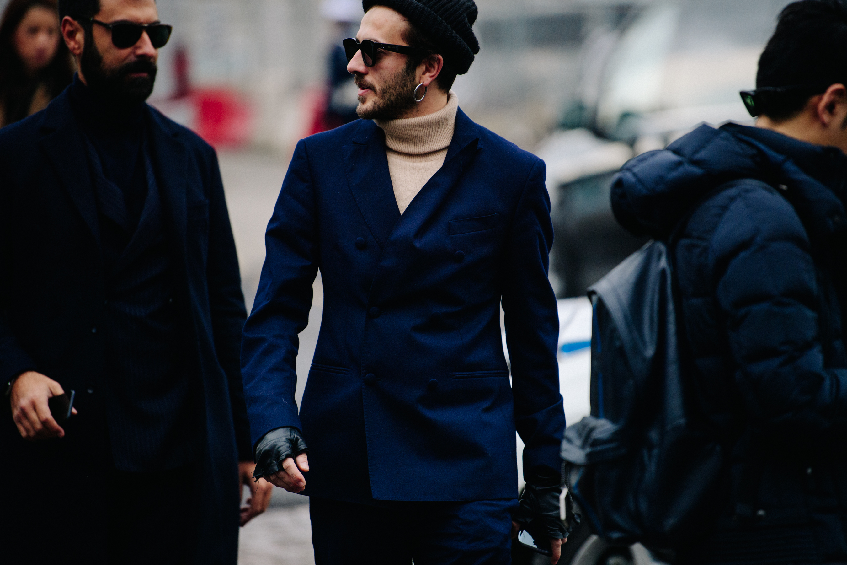 Two men wearing dark suits