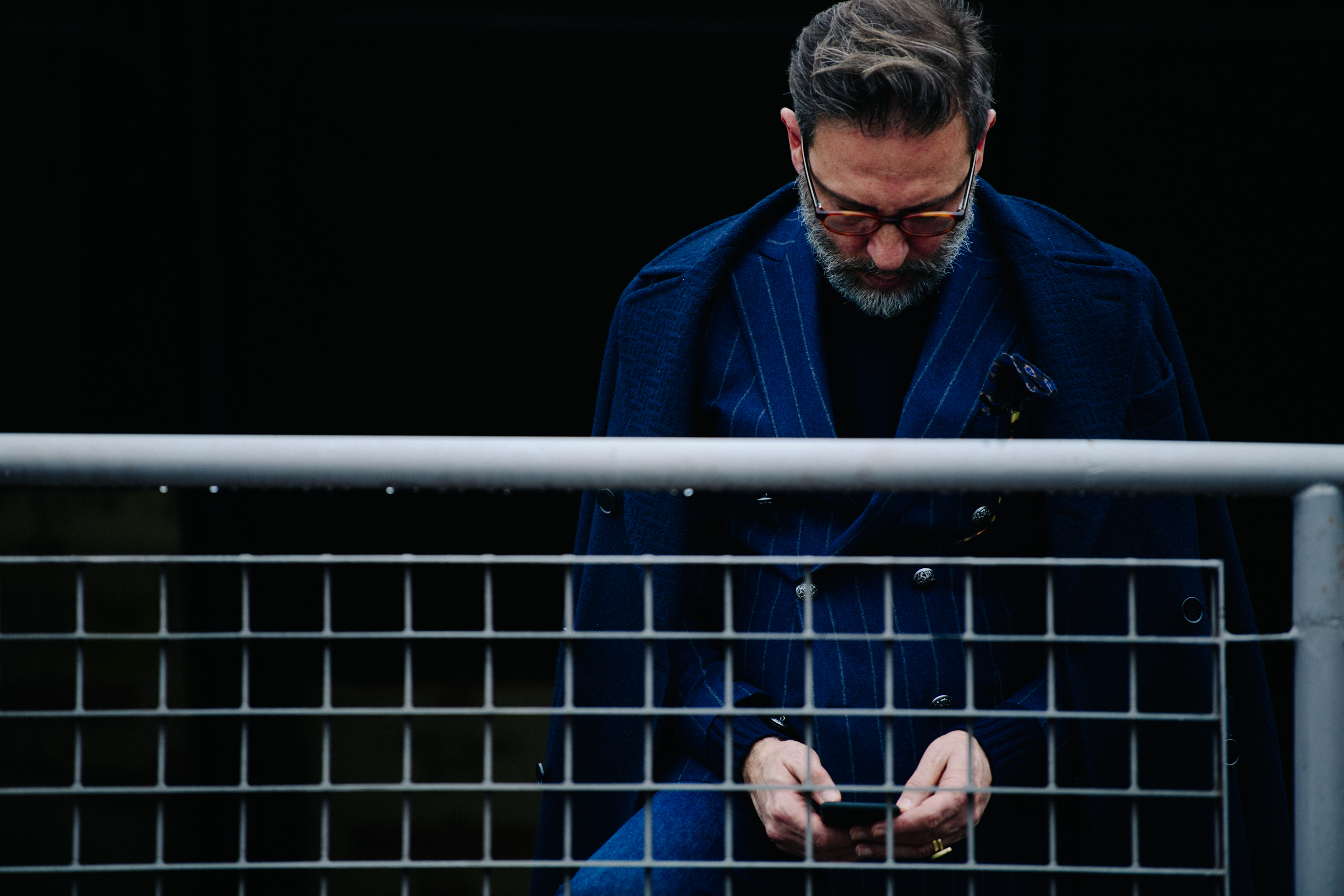Man wearing blue suit and coat