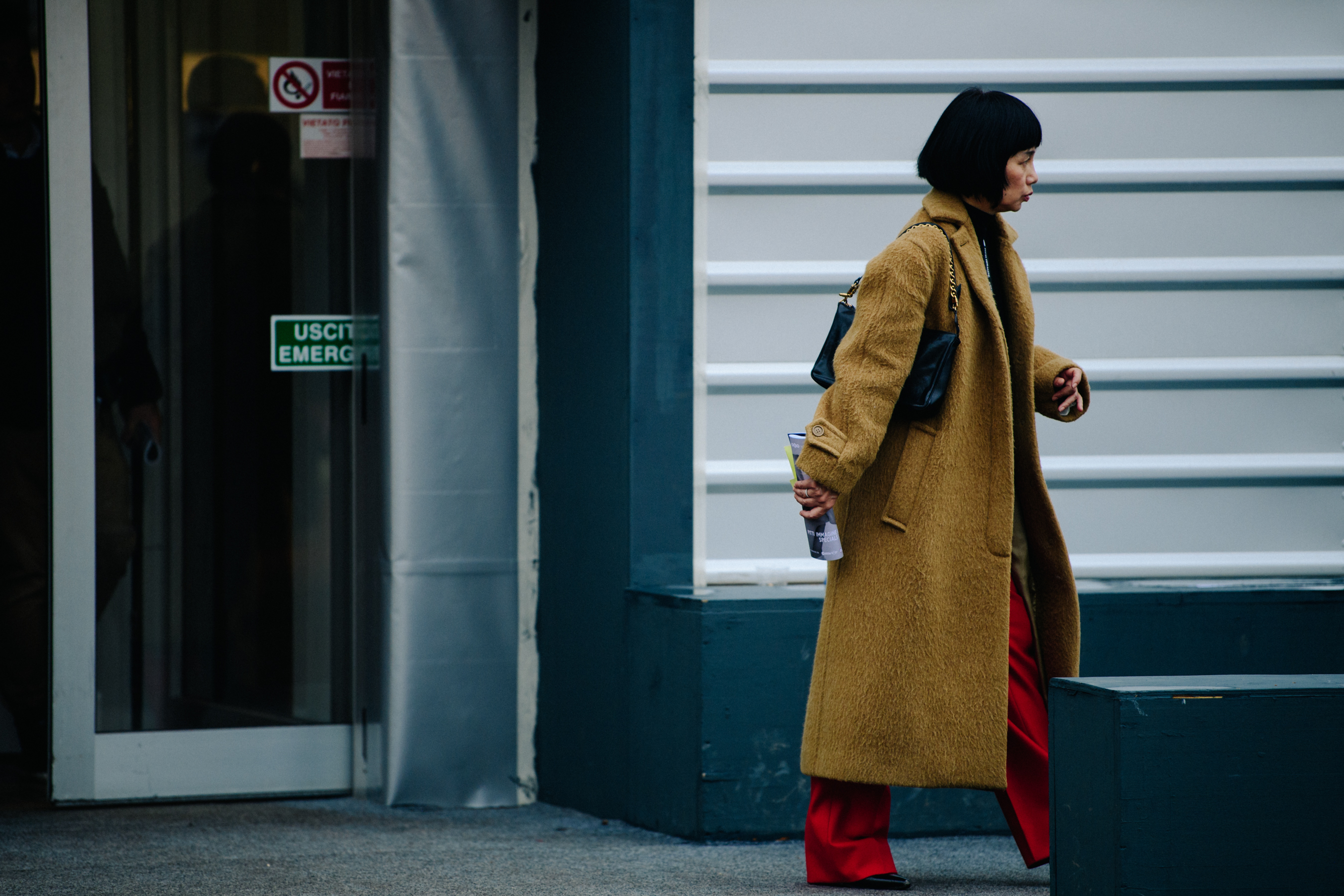 Woman wearing long camel wool coat