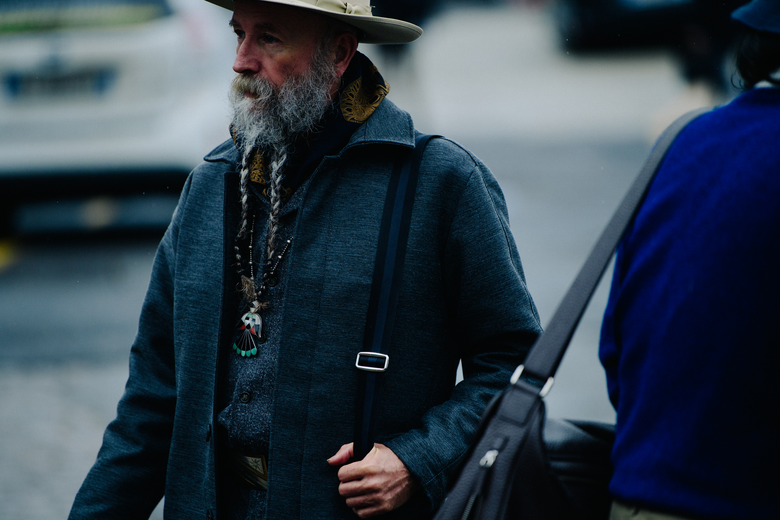 Man with long grey beard and coat