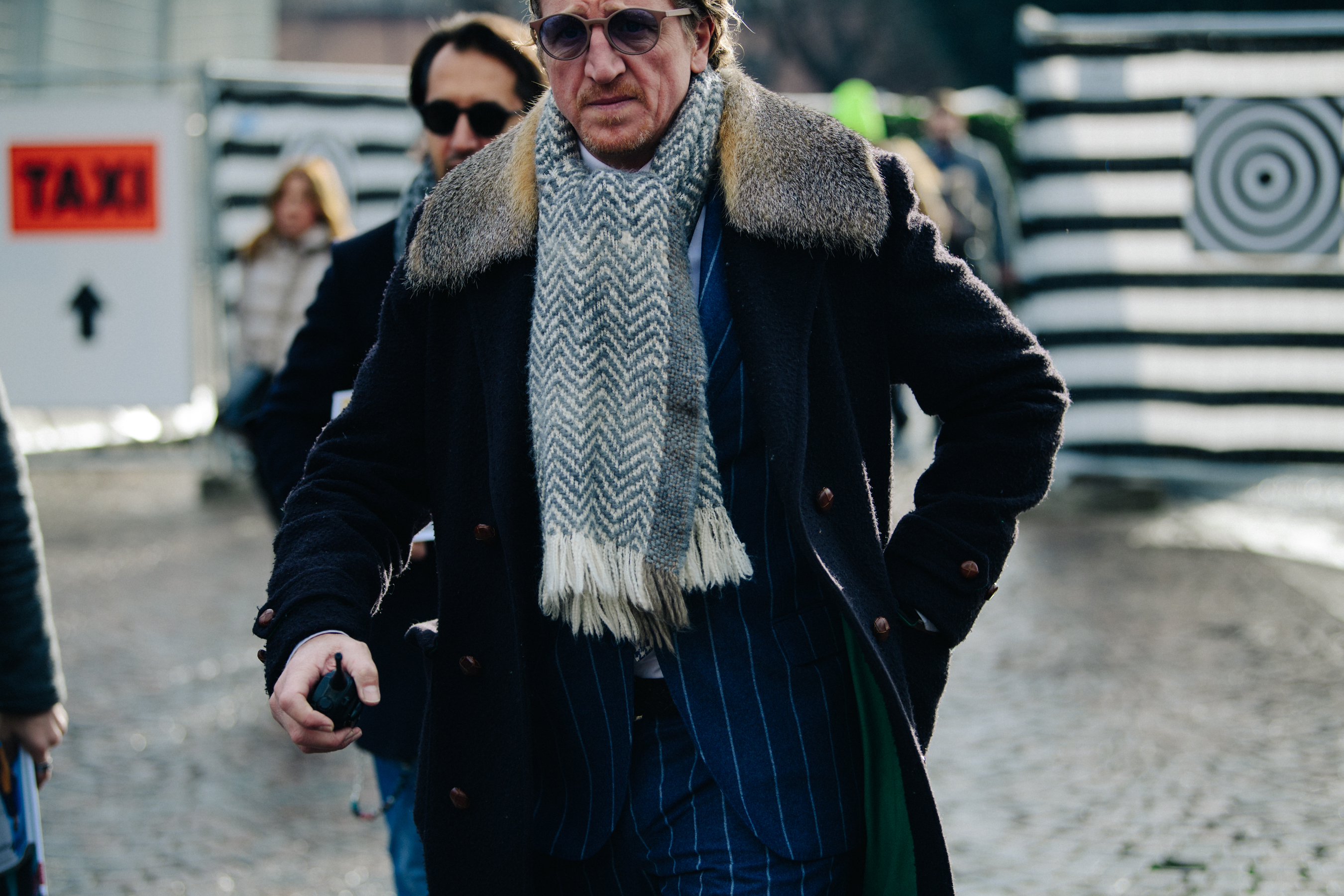 Man wearing fur collar coat