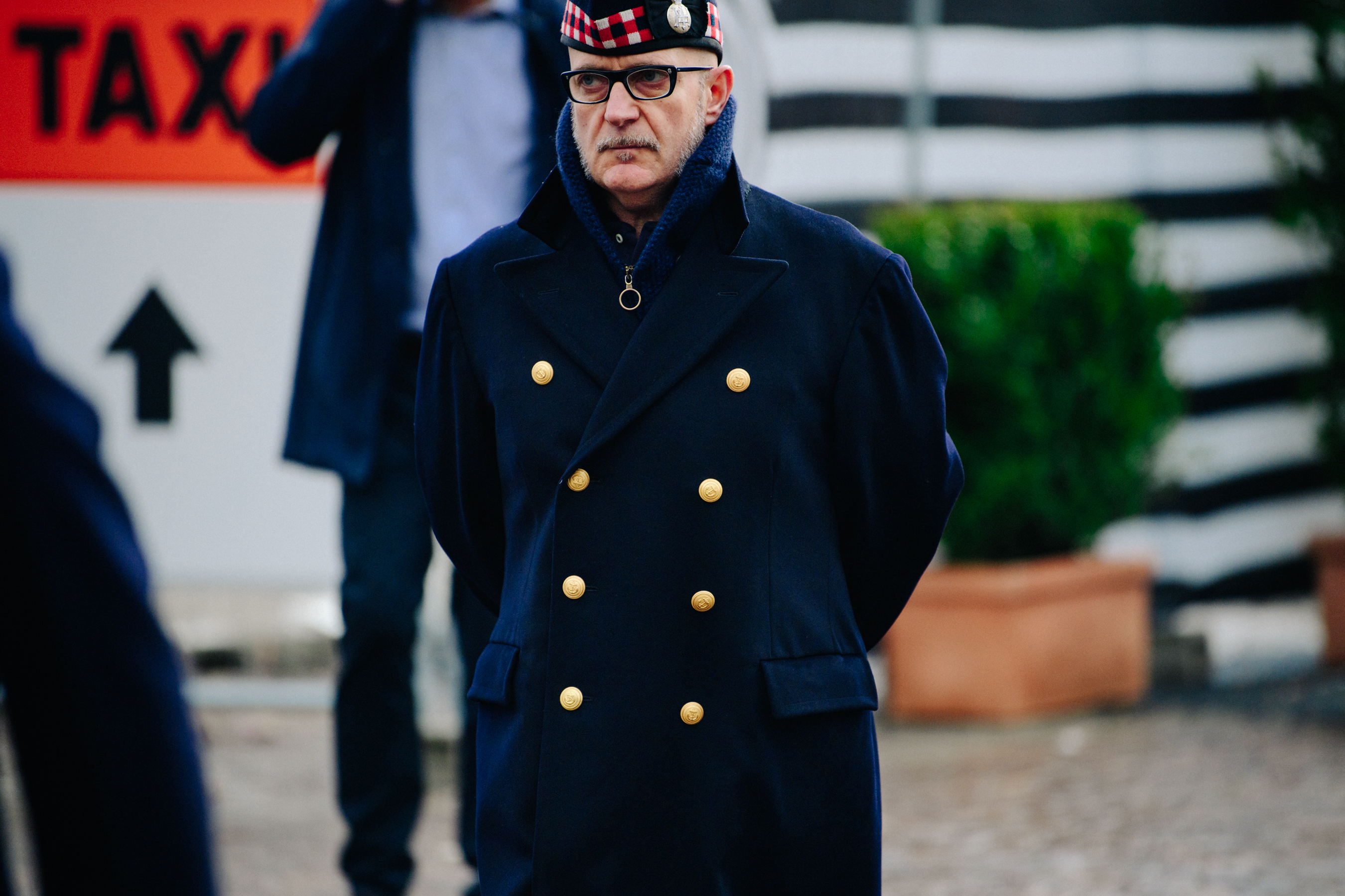 Man wearing blue Navy coat
