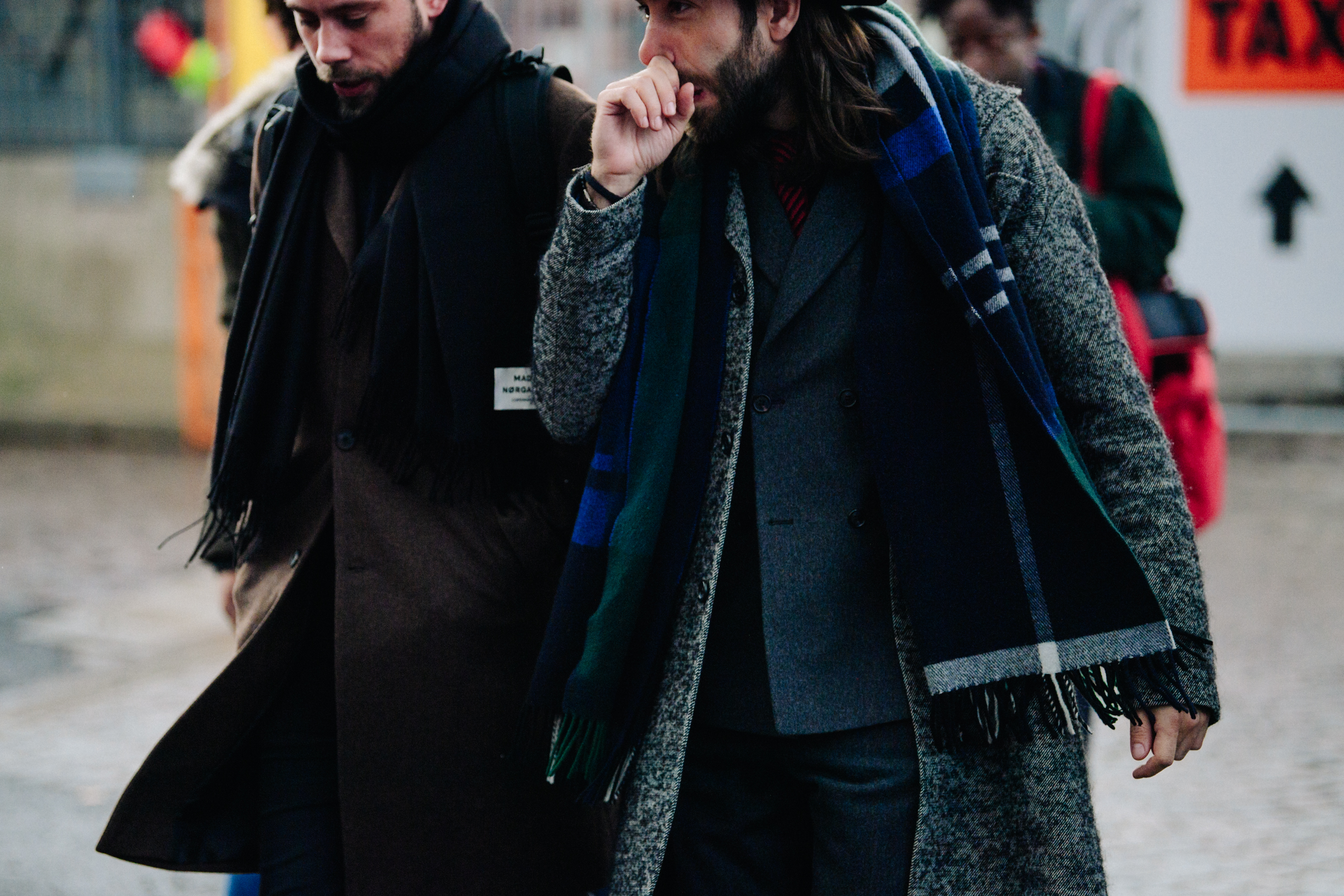 Two men wearing winter coats