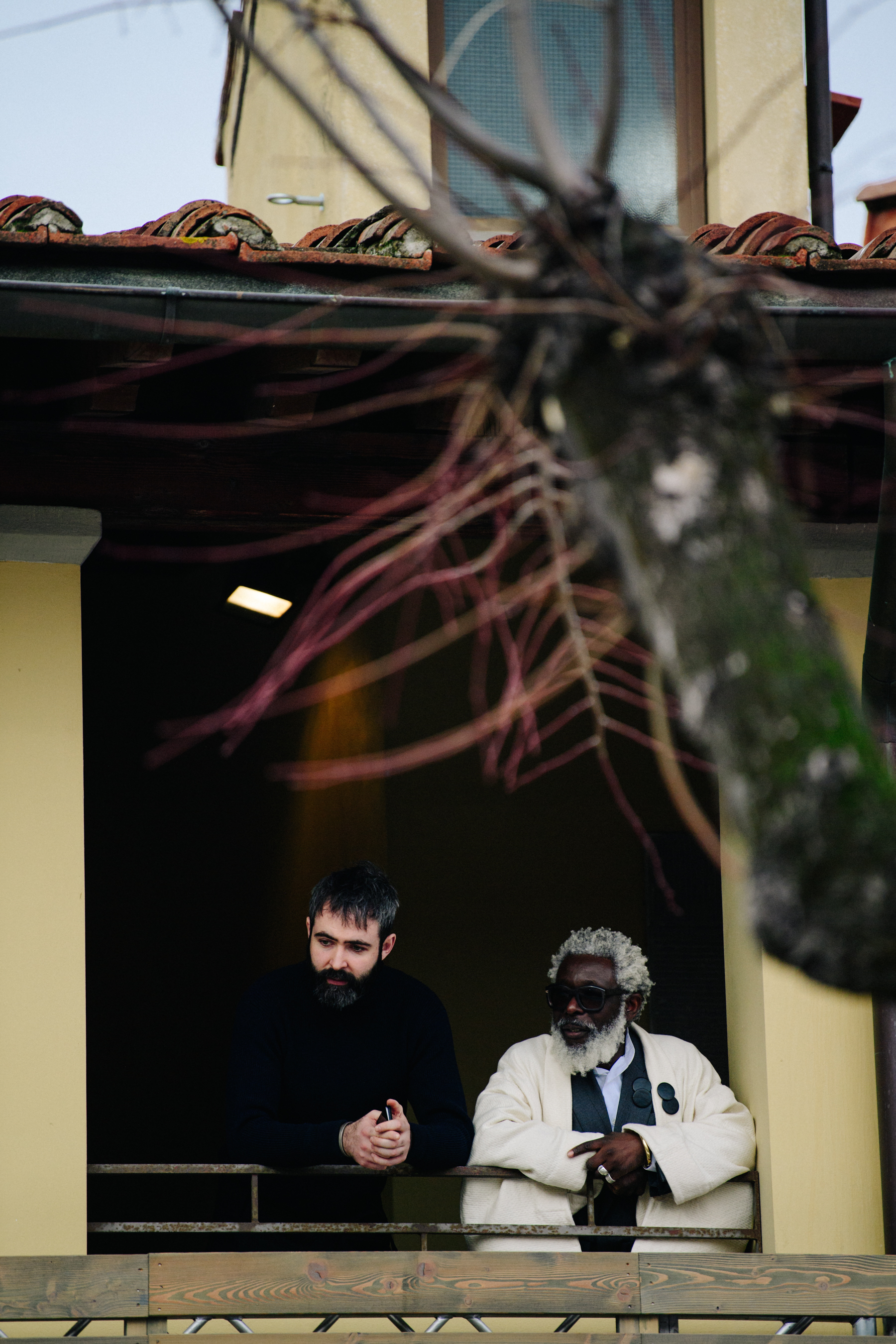 Michael Nartey and friend stood on balcony