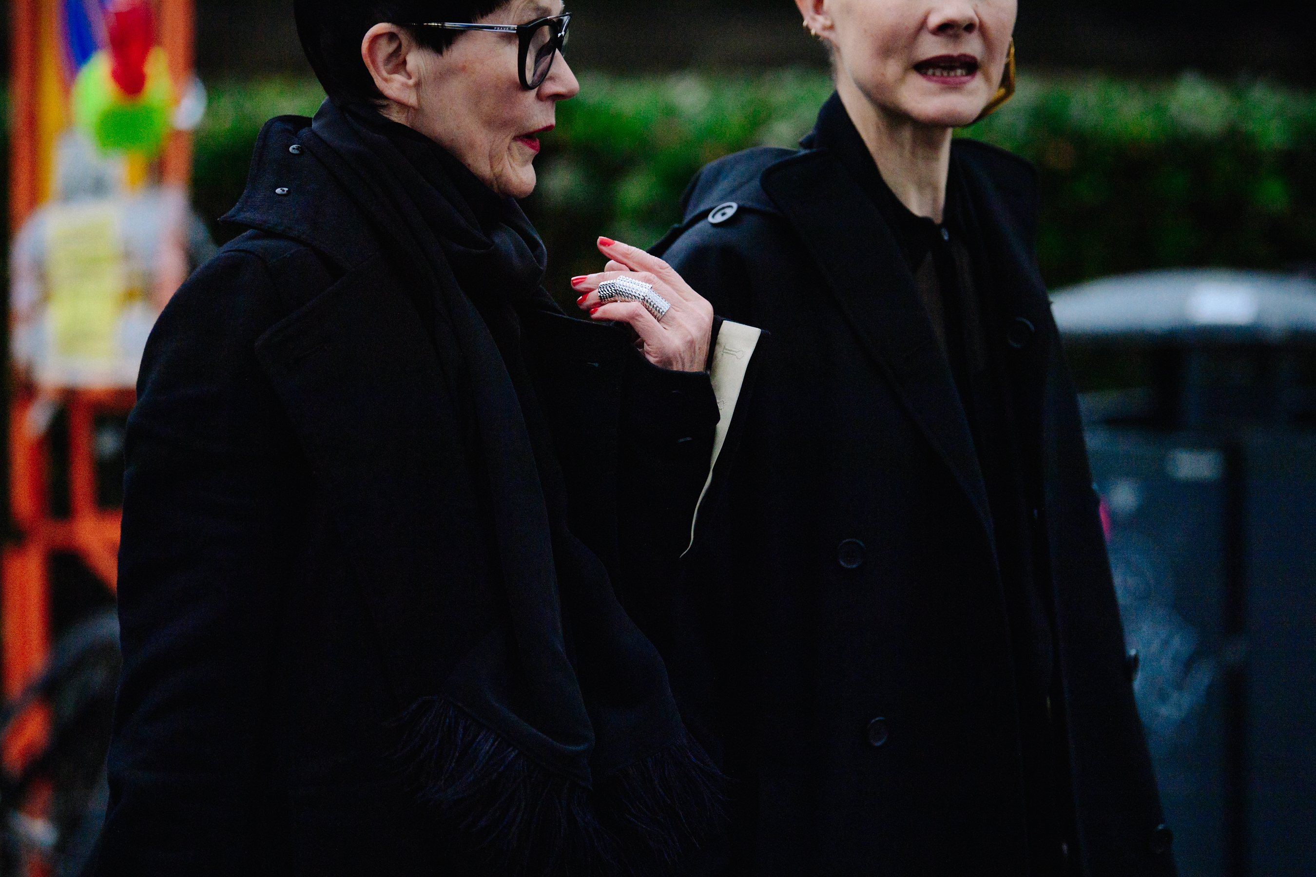 Two women in dark coats