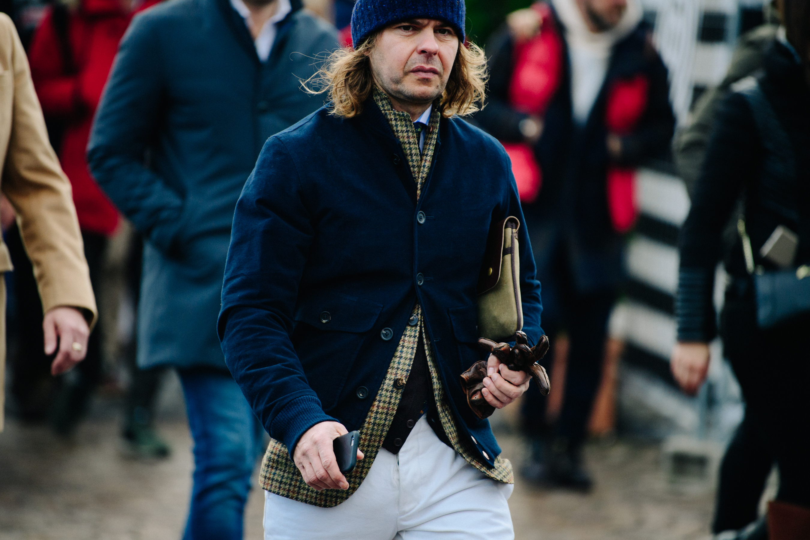 Man wearing blue blazer and beanie