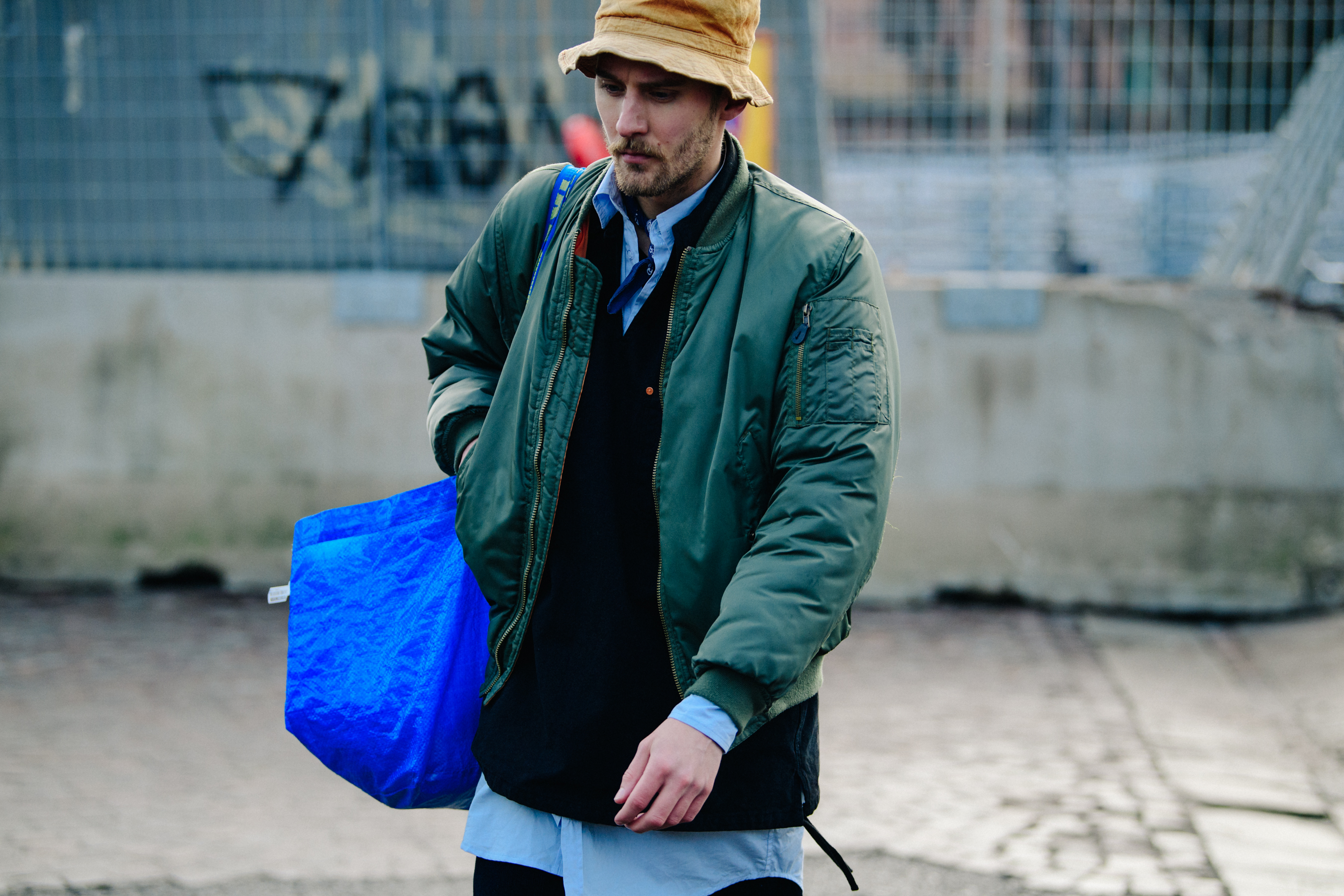 Man holding Ikea shopping bag