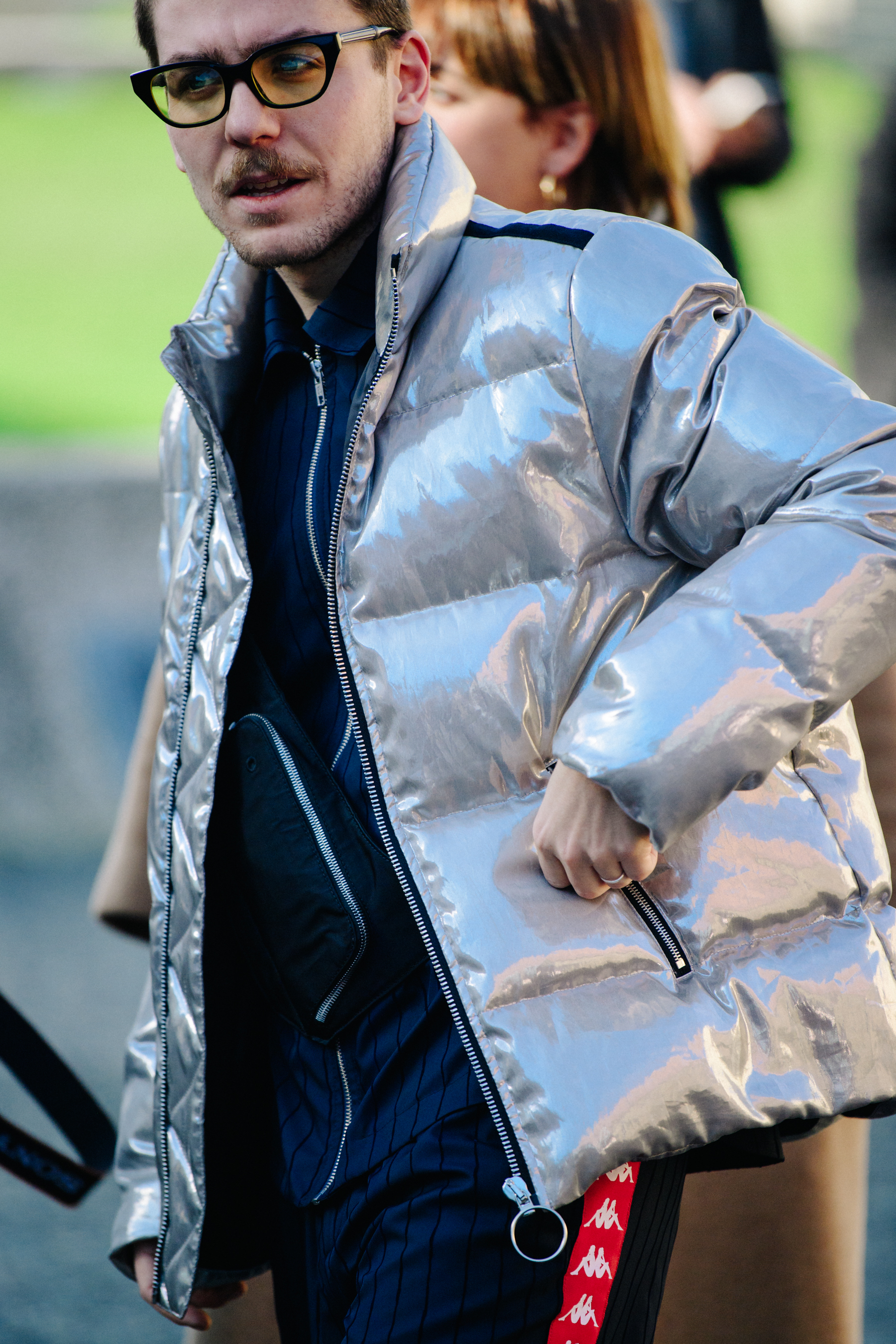 Man wearing silver puffer jacket