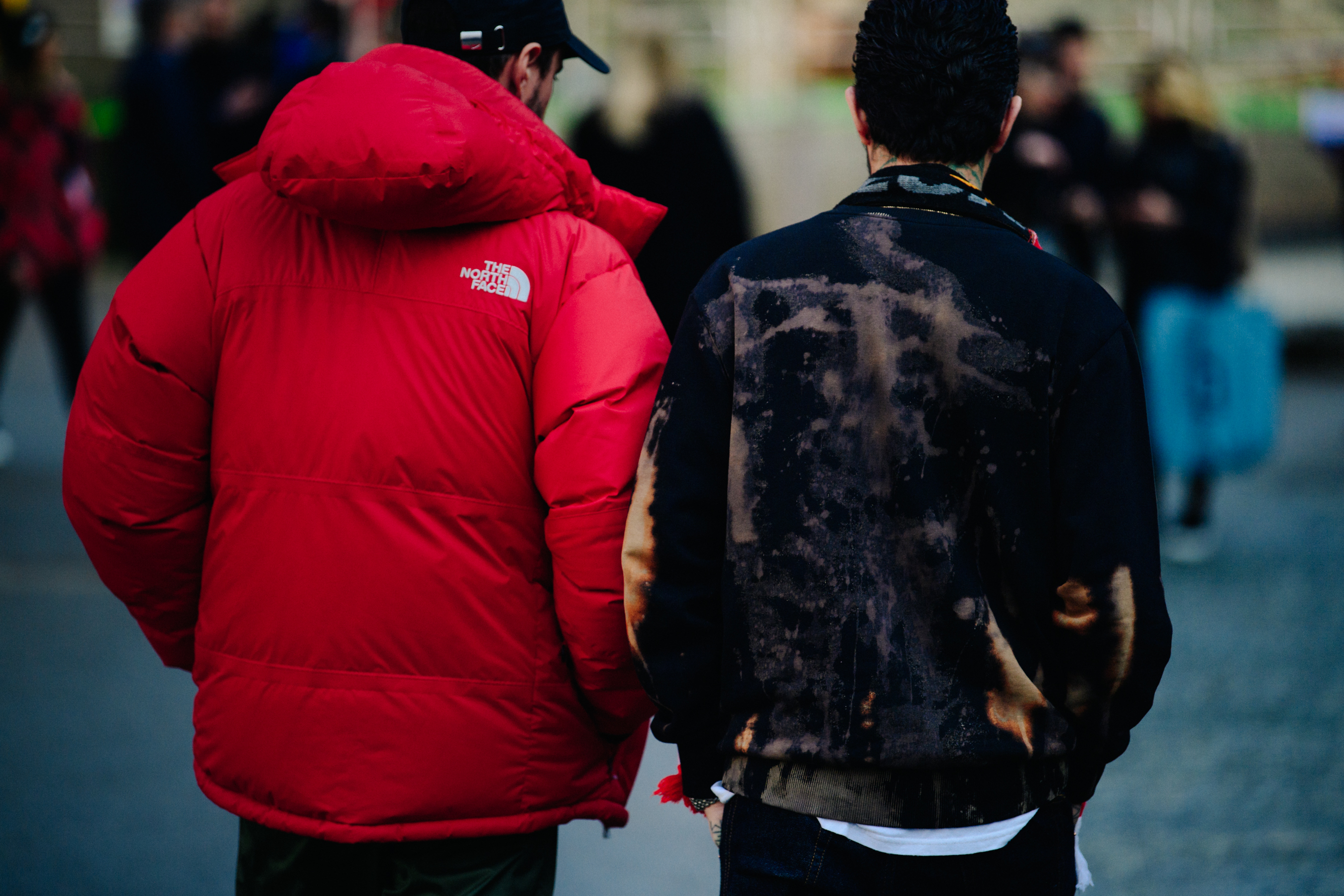Two men wearing red and black