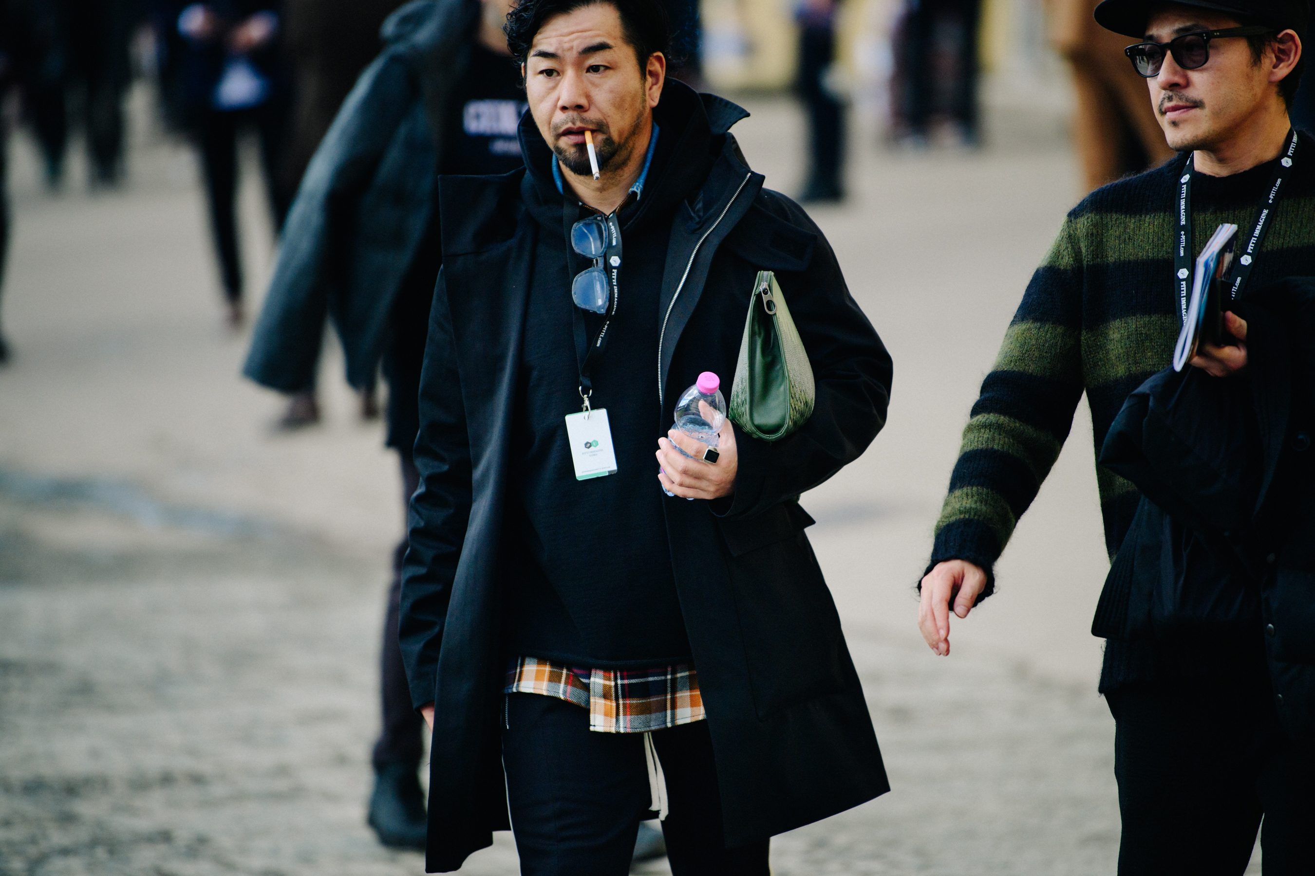 Asian man with cigarette in mouth