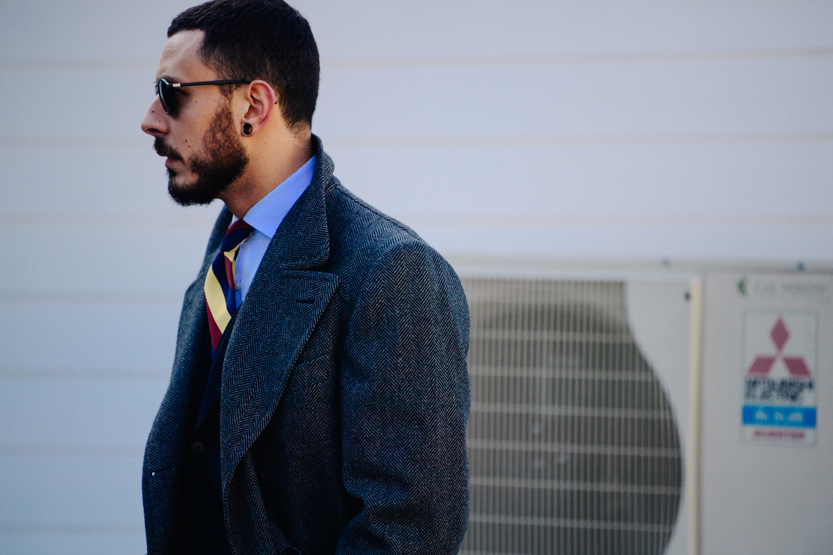 Man wearing grey Herringbone coat