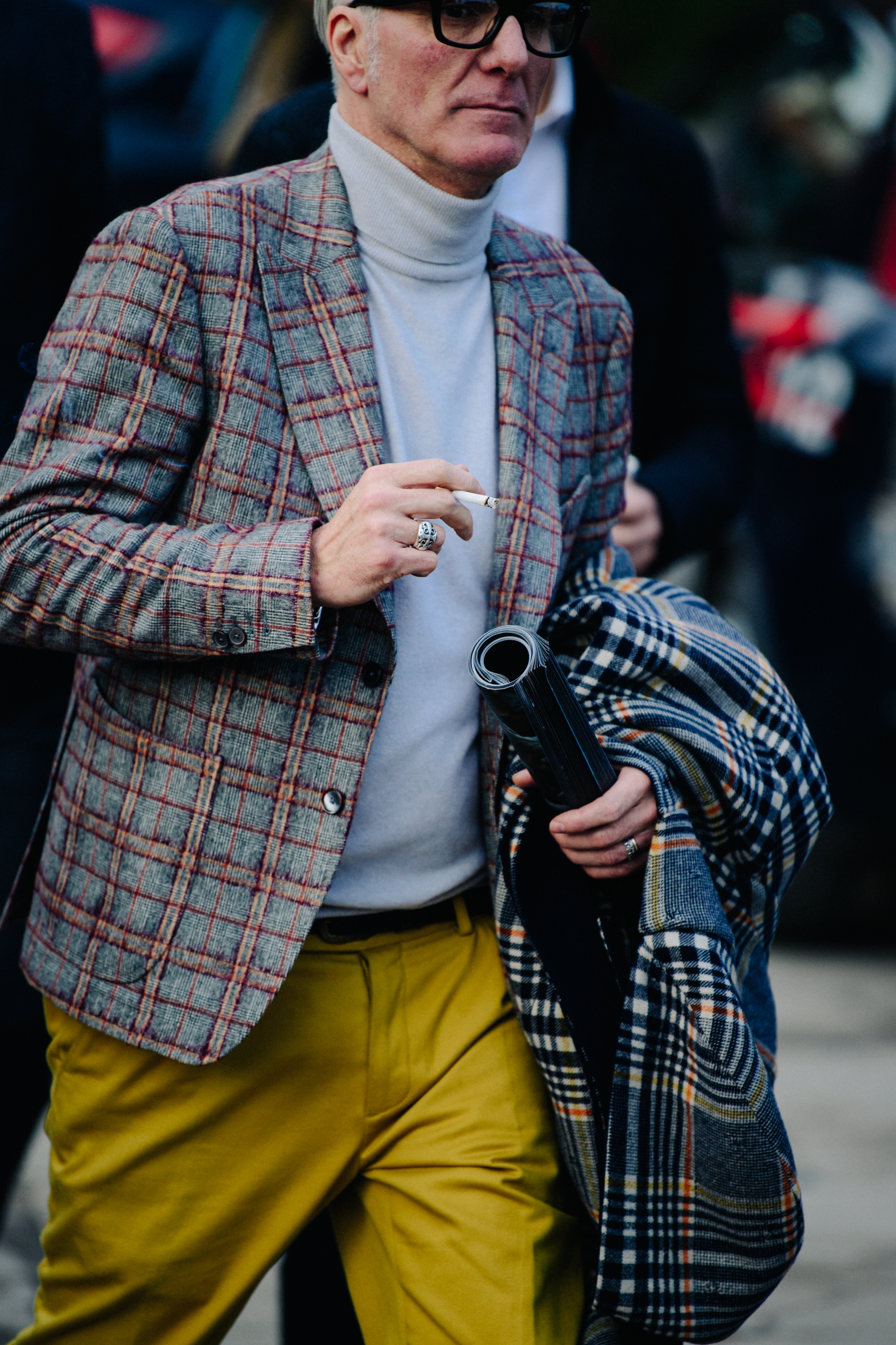 Man wearing grey and red check jacket