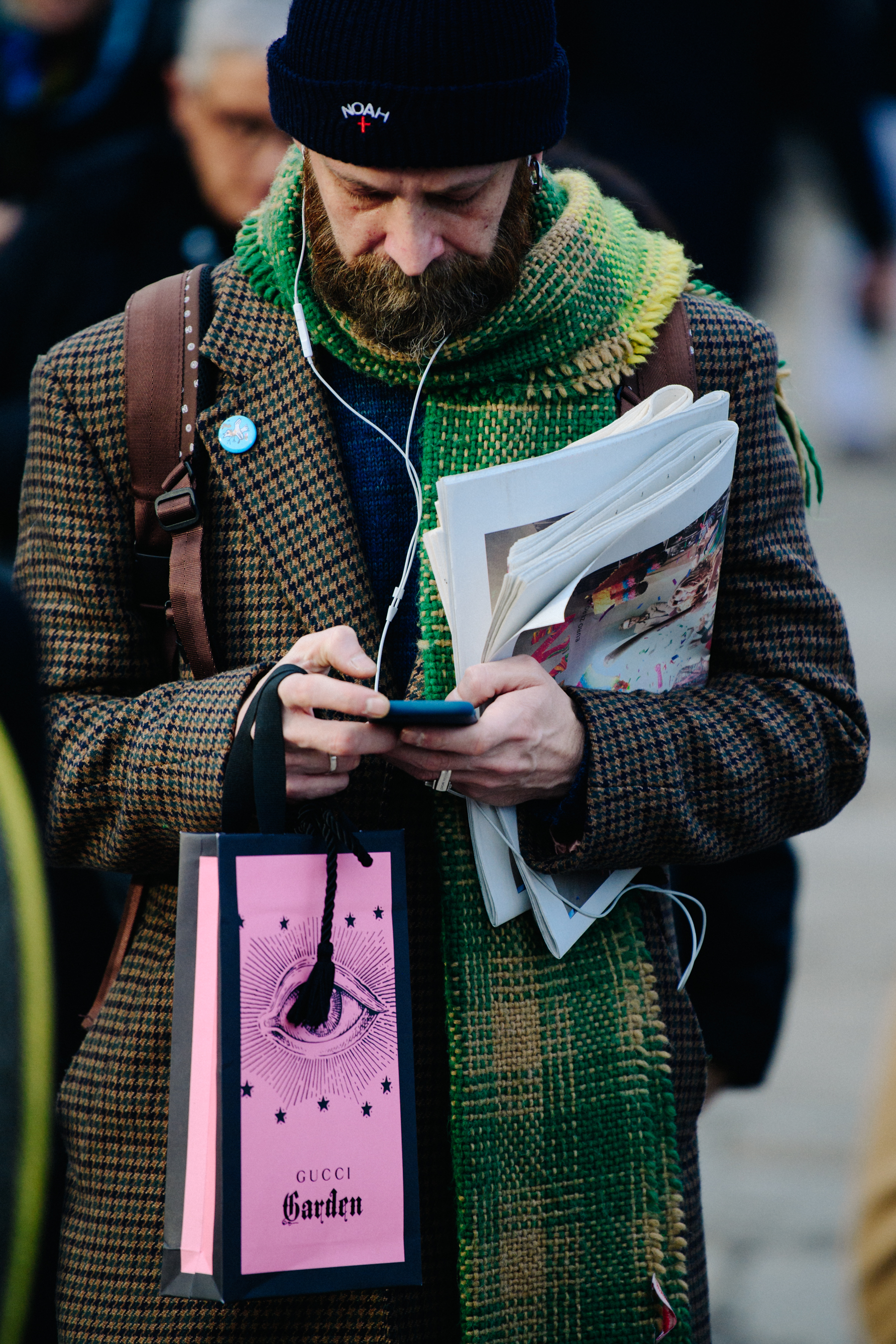 Man wearing green scarf