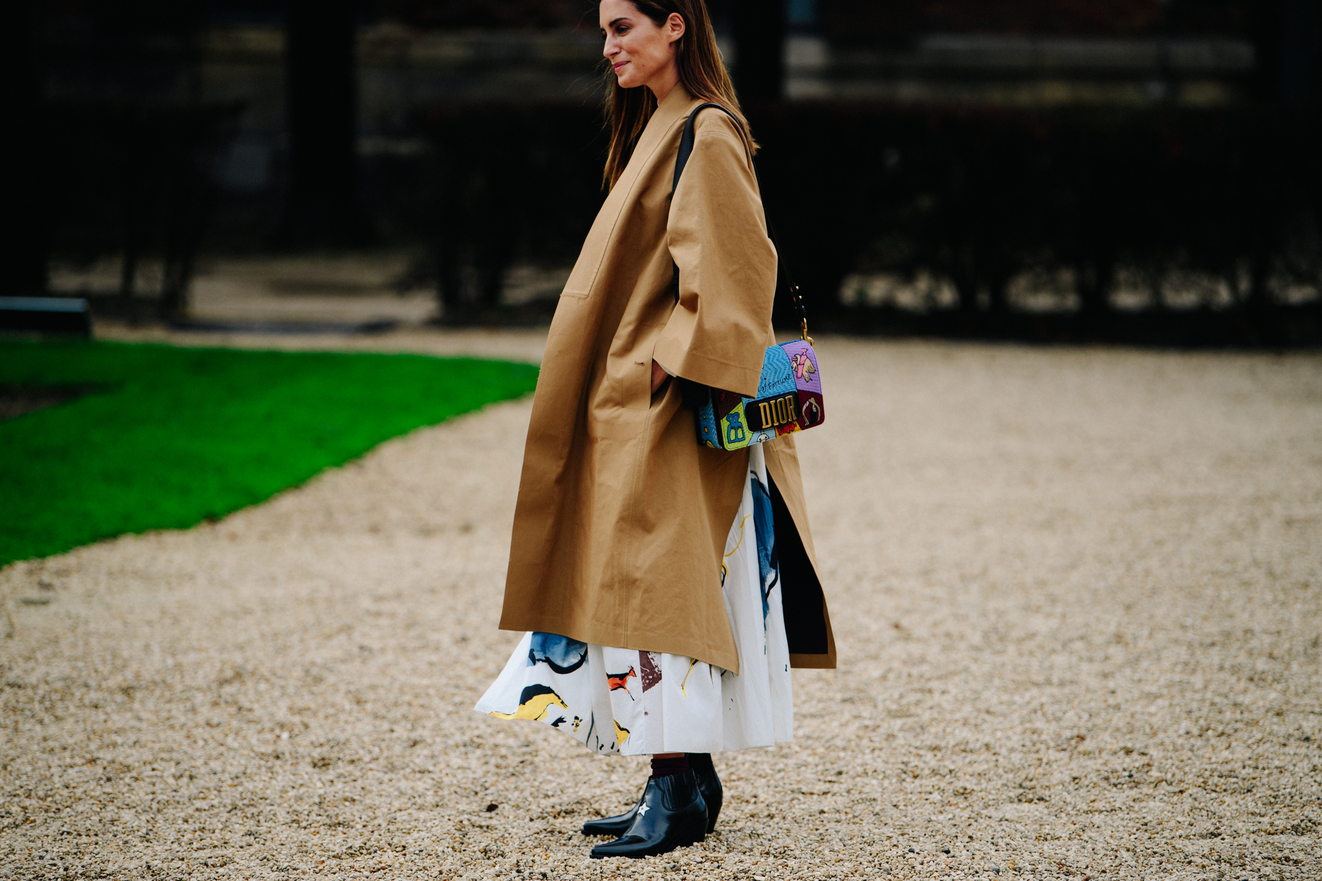 Woman wearing tan coat
