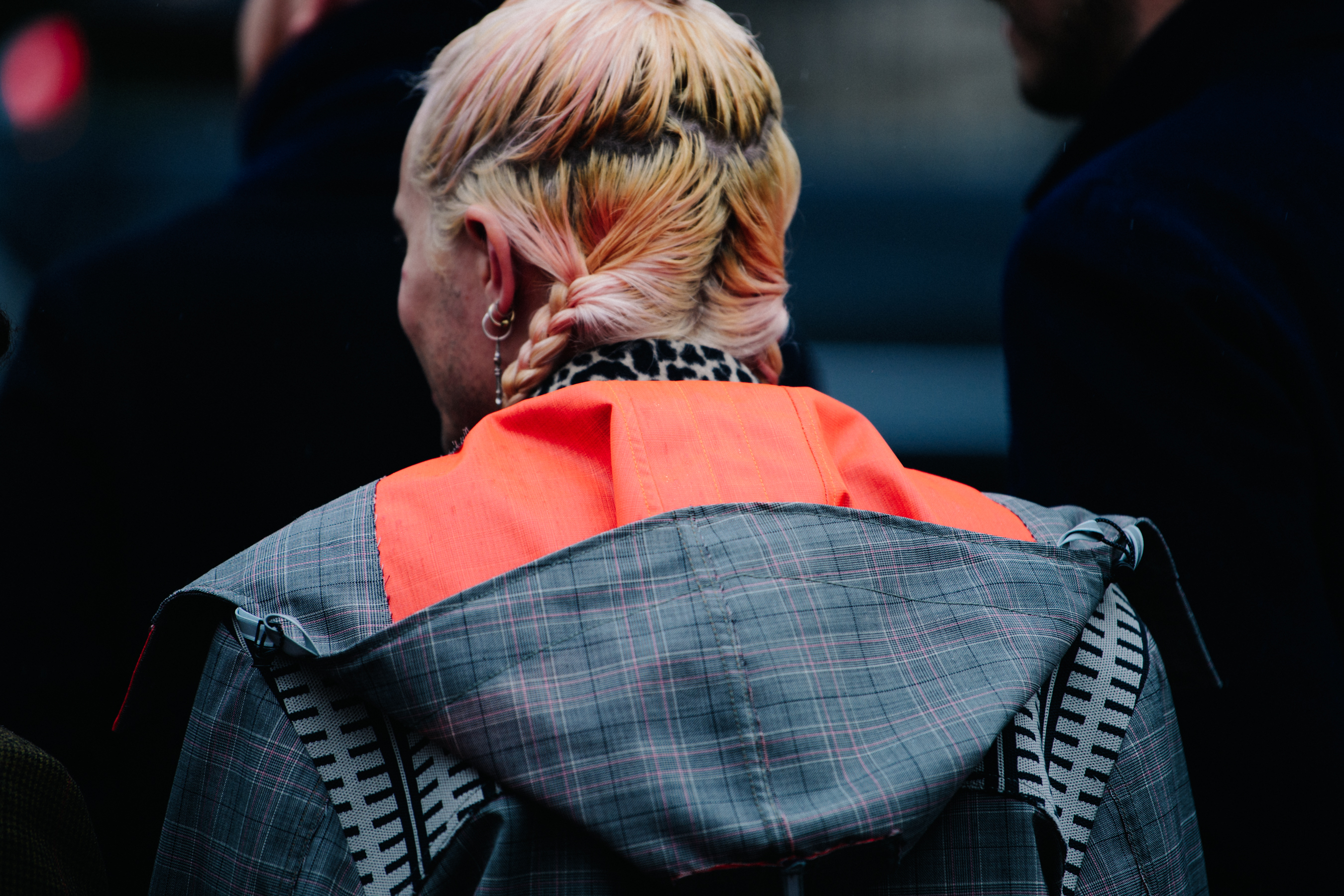 British editor wearing grey coat