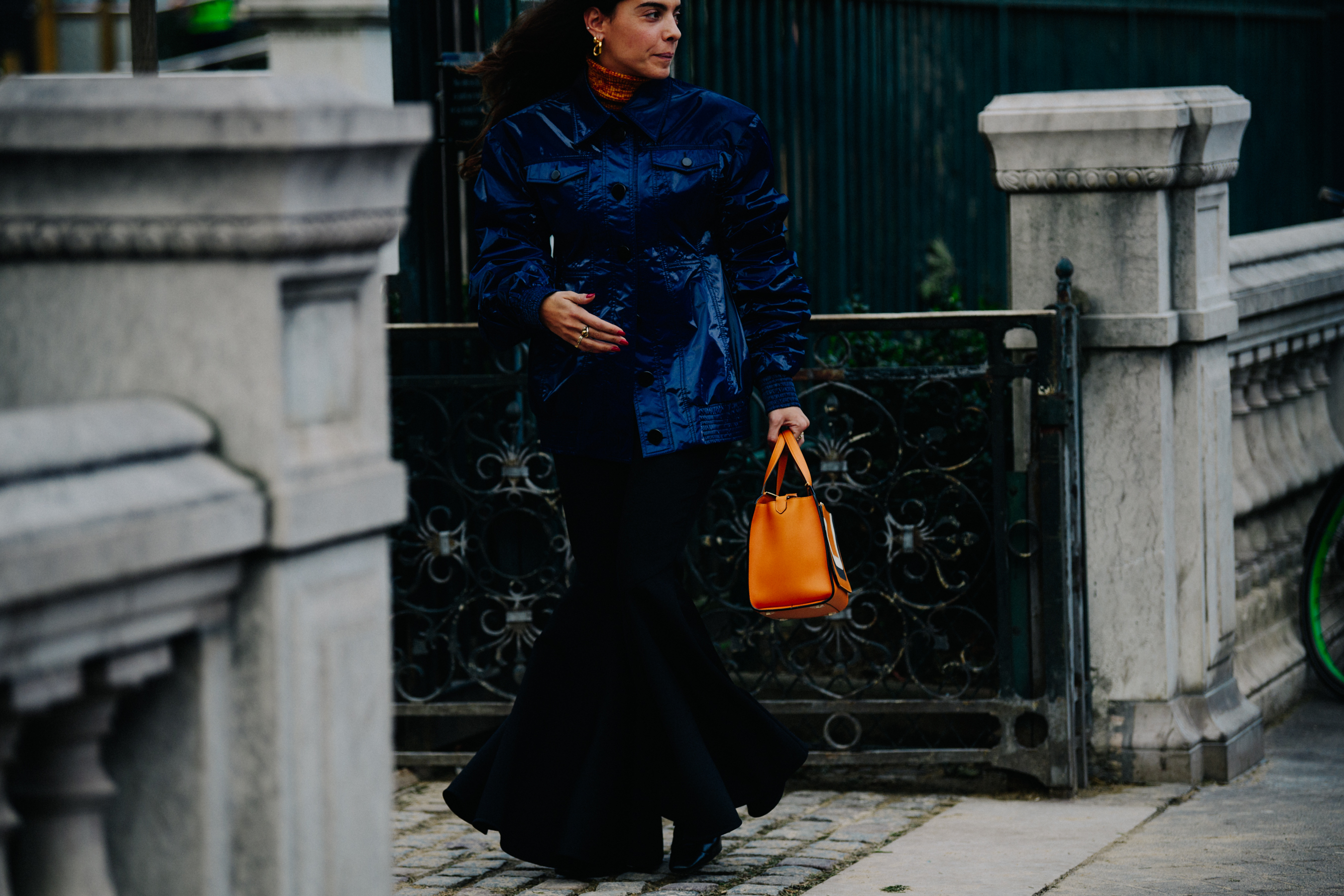 Italian woman wearing blue shiny jacket