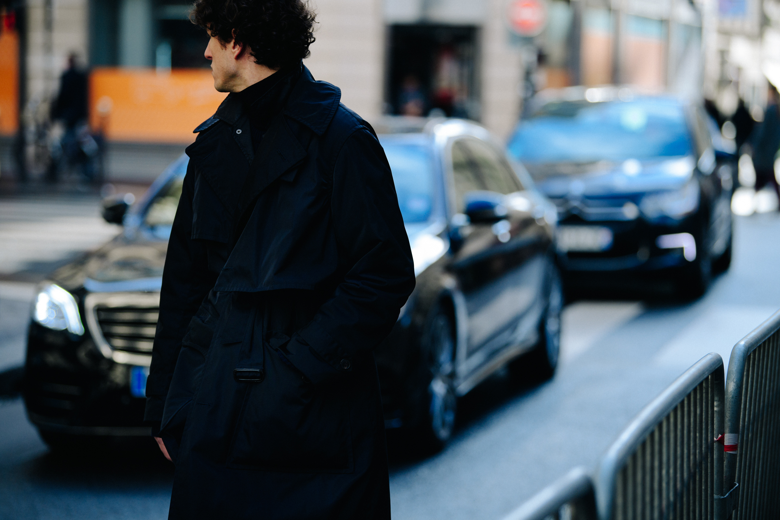 Man wearing belted trench coat