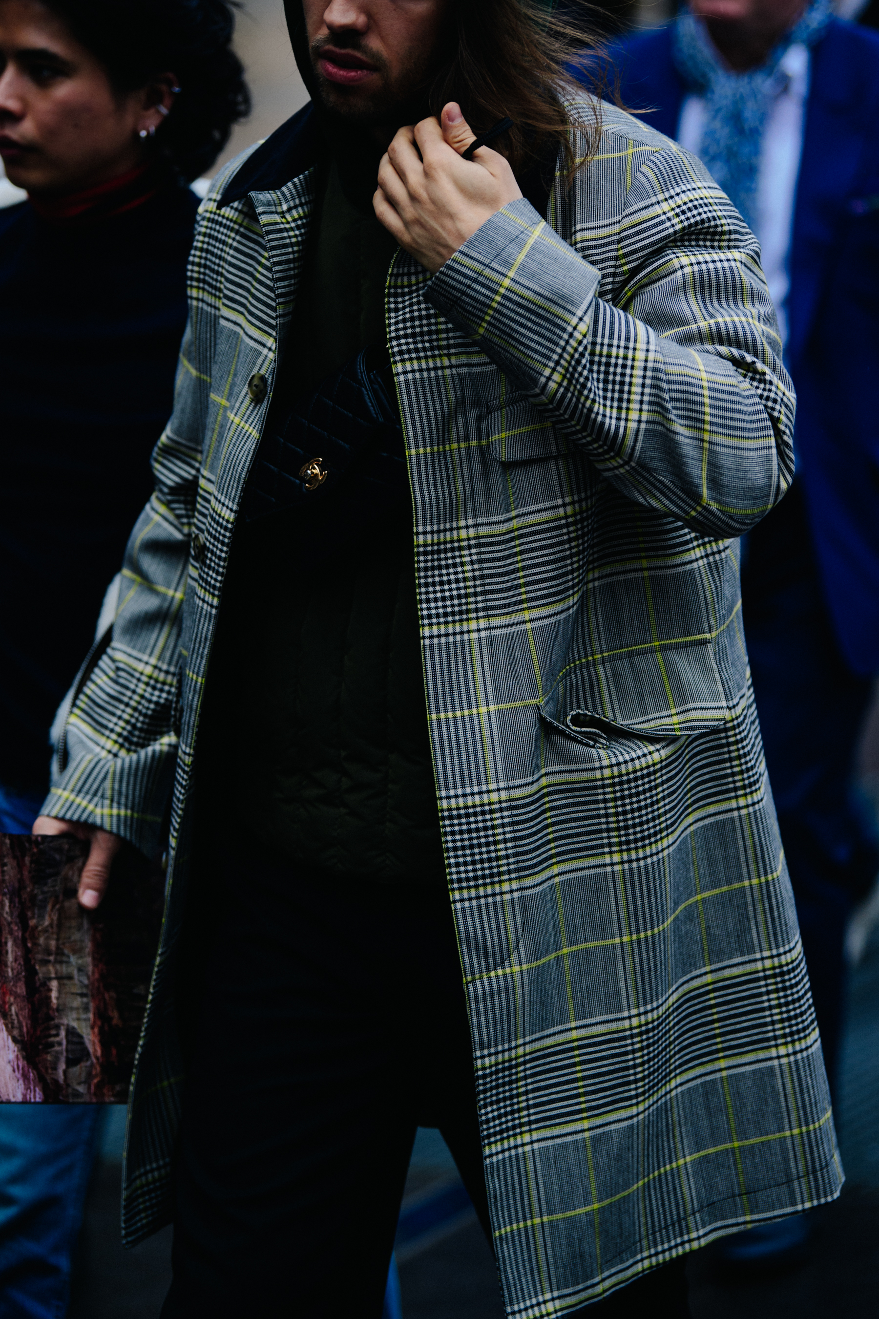 Man wearing grey check coat