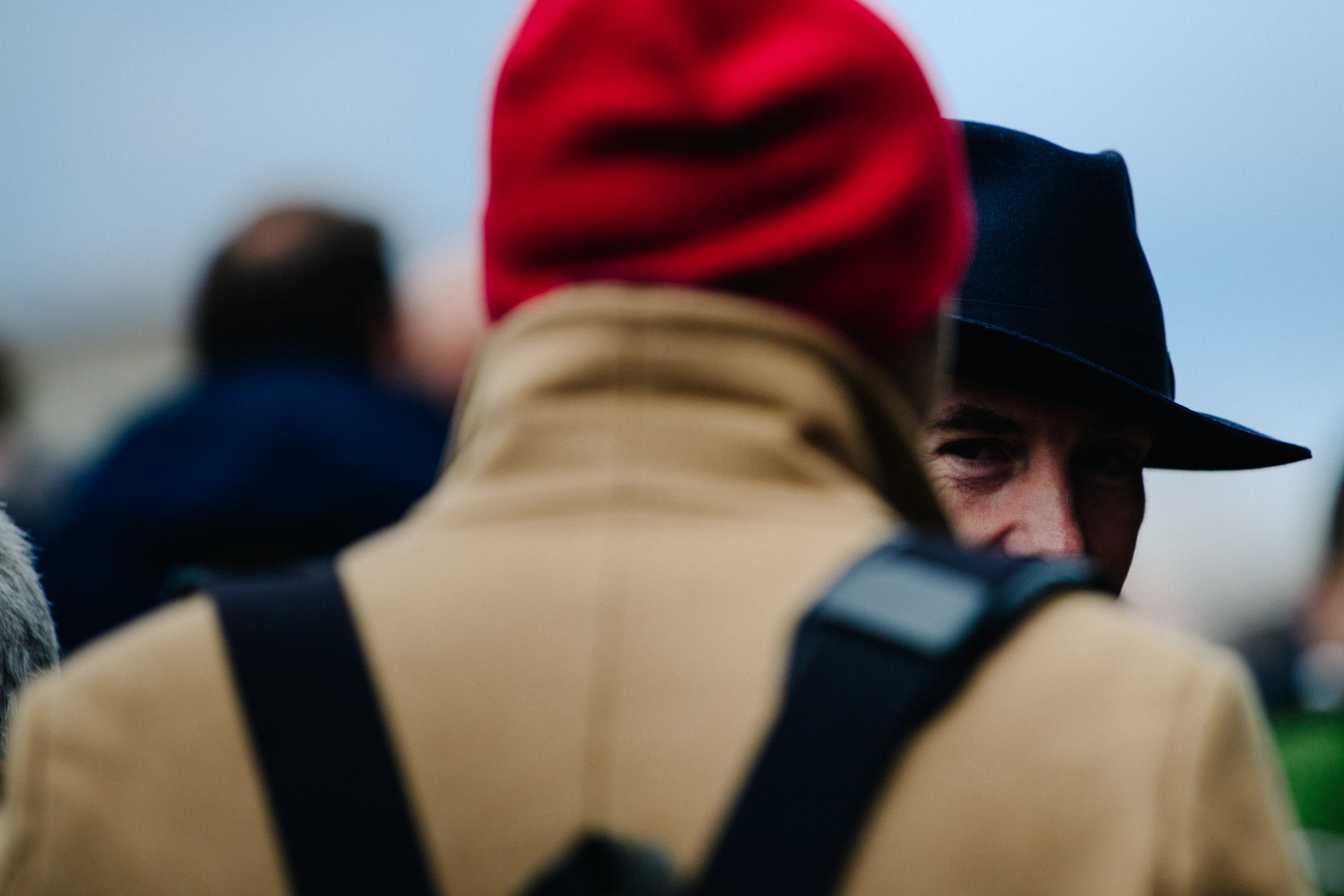 Man wearing blue rimmed hat
