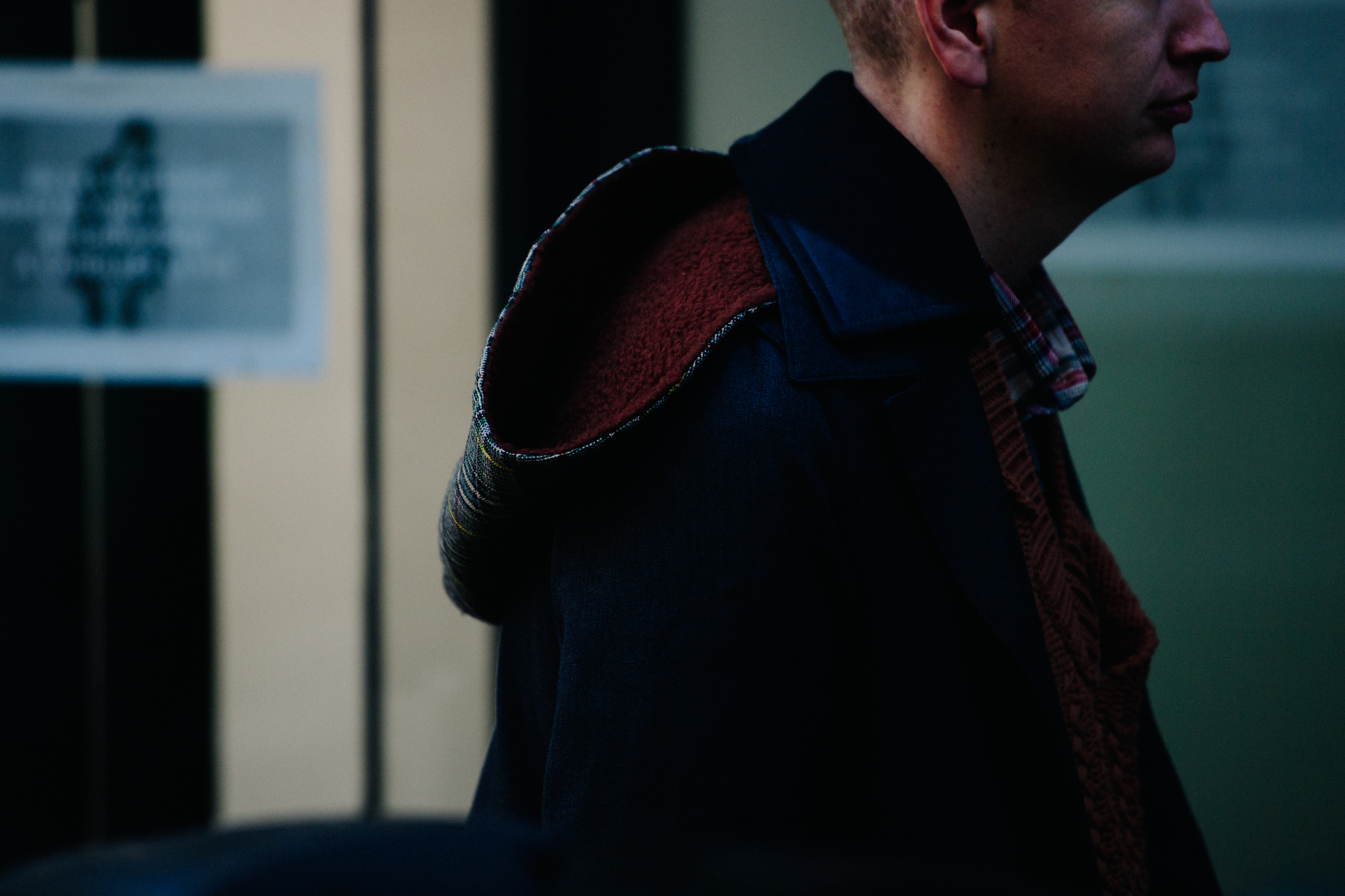 French man wearing leather hooded coat