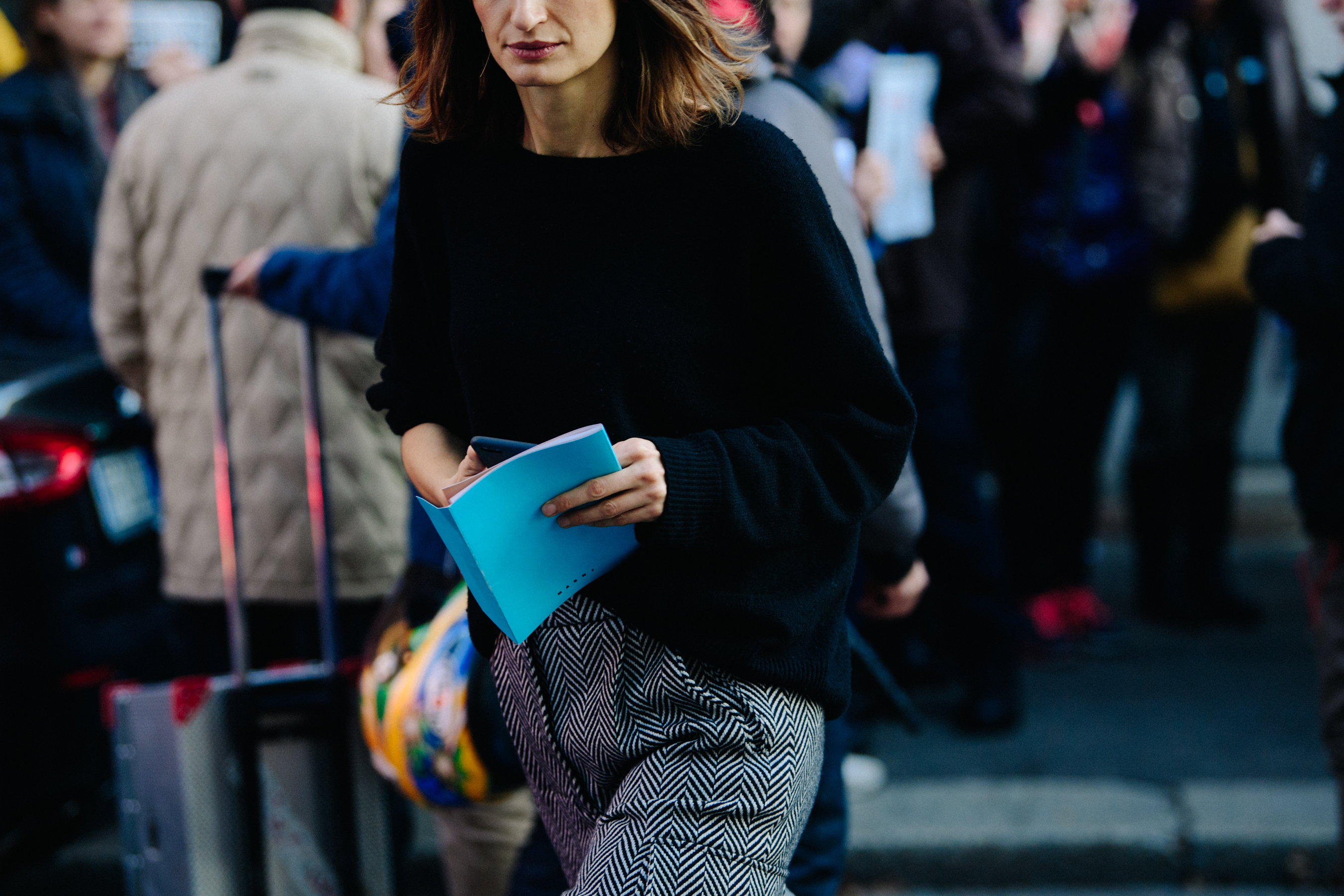 Woman holding blue Marni FW18 invite