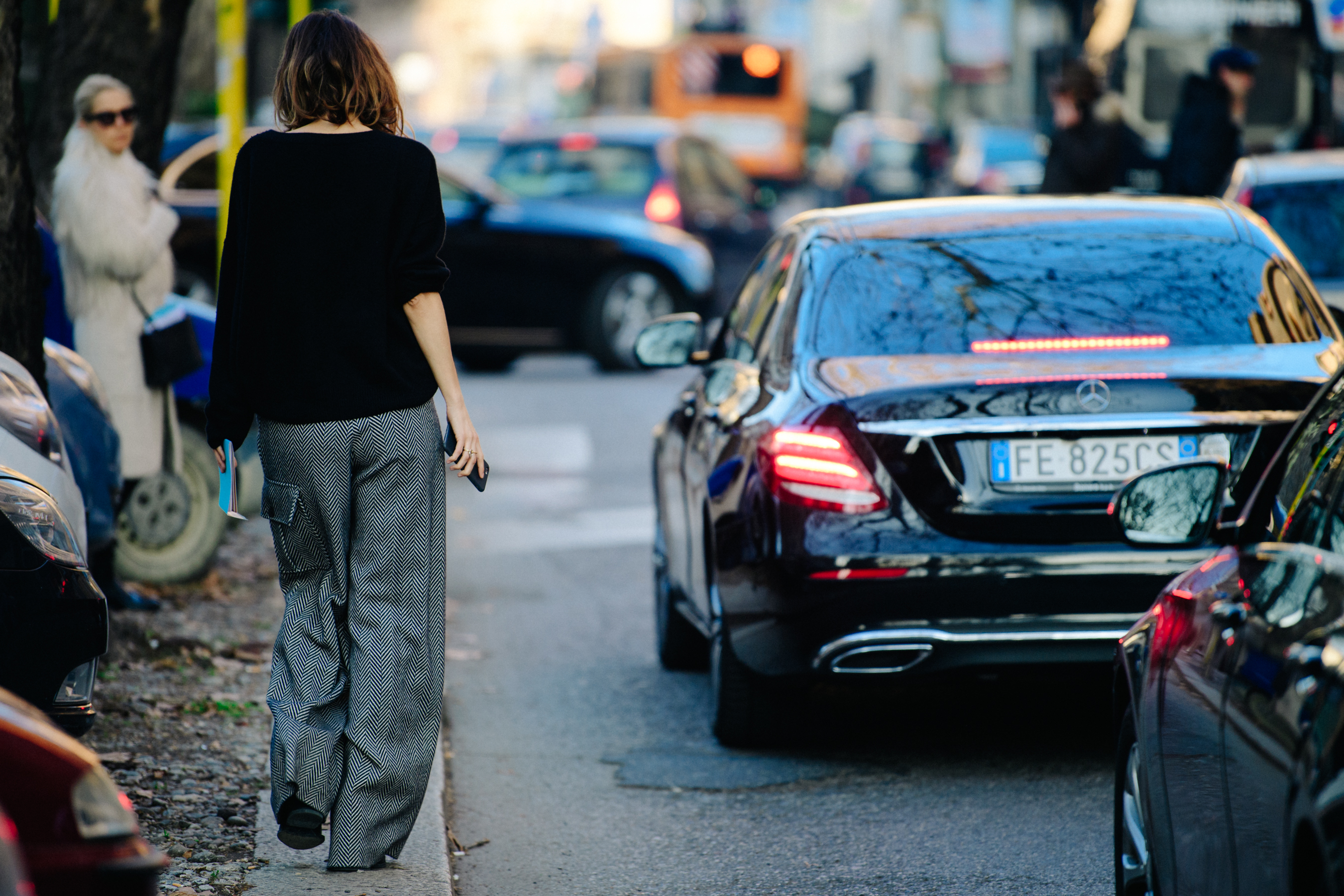 Woman wearing herringbone pants