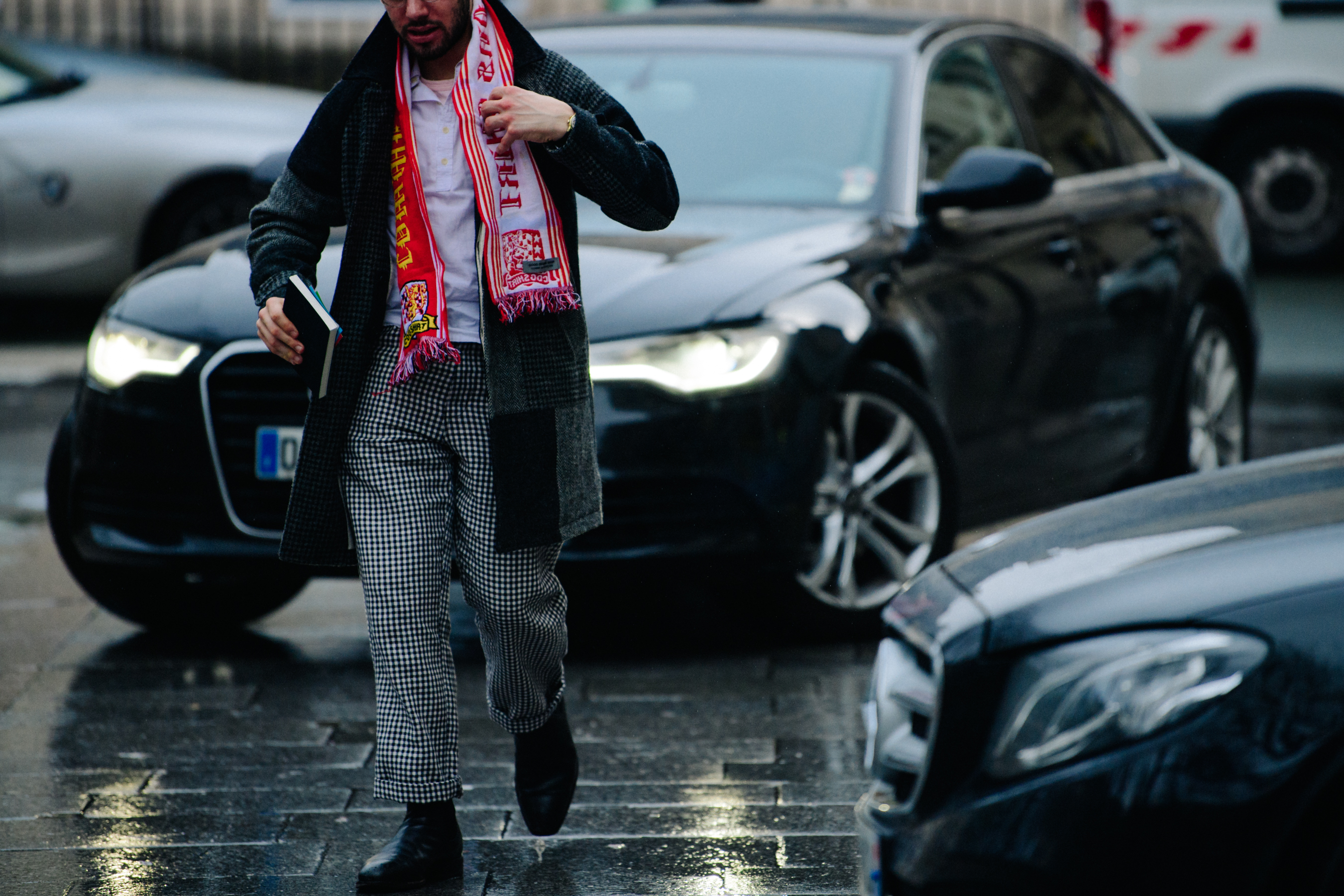 Man wearing red football scarf