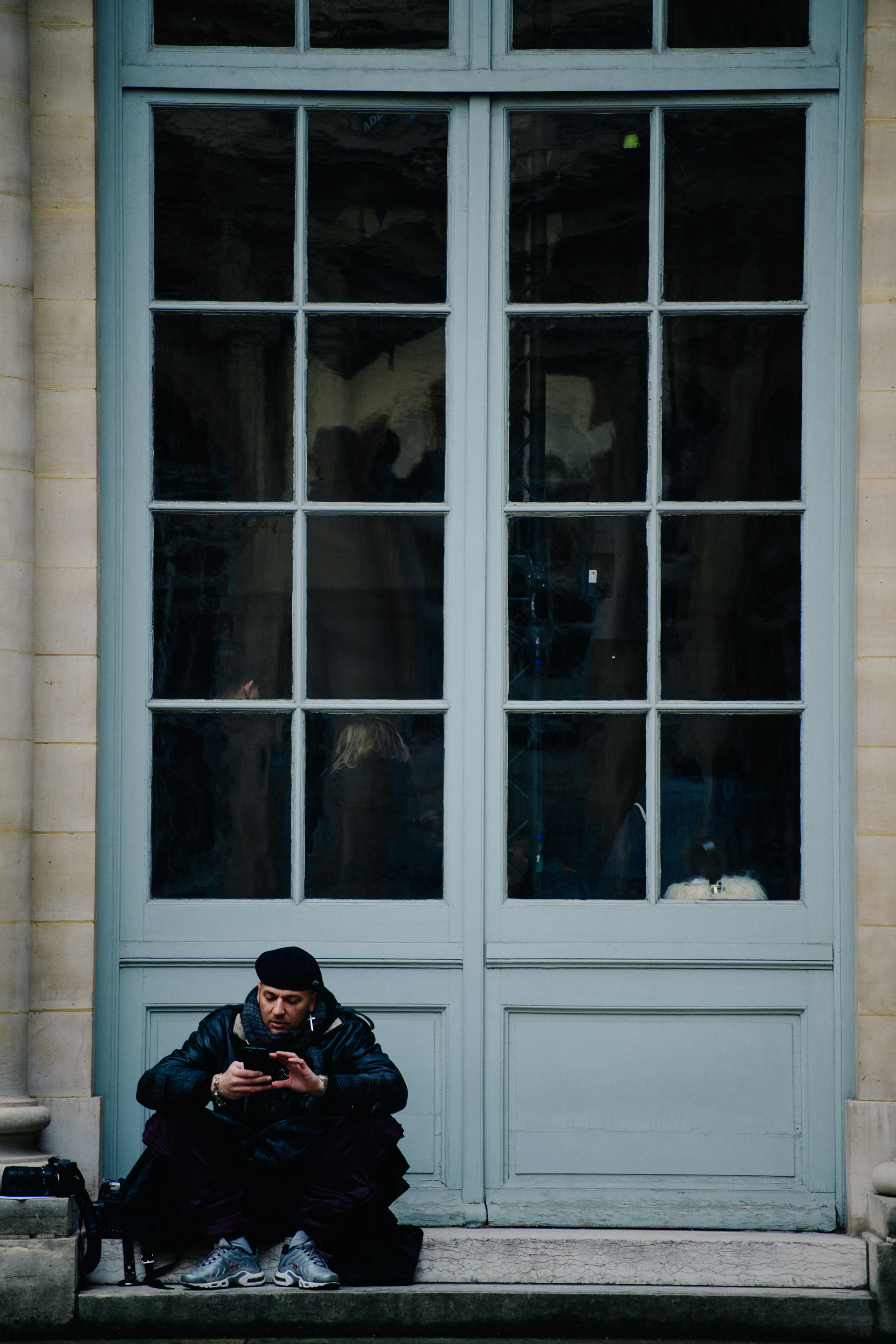 French photographer wearing Nike sneakers