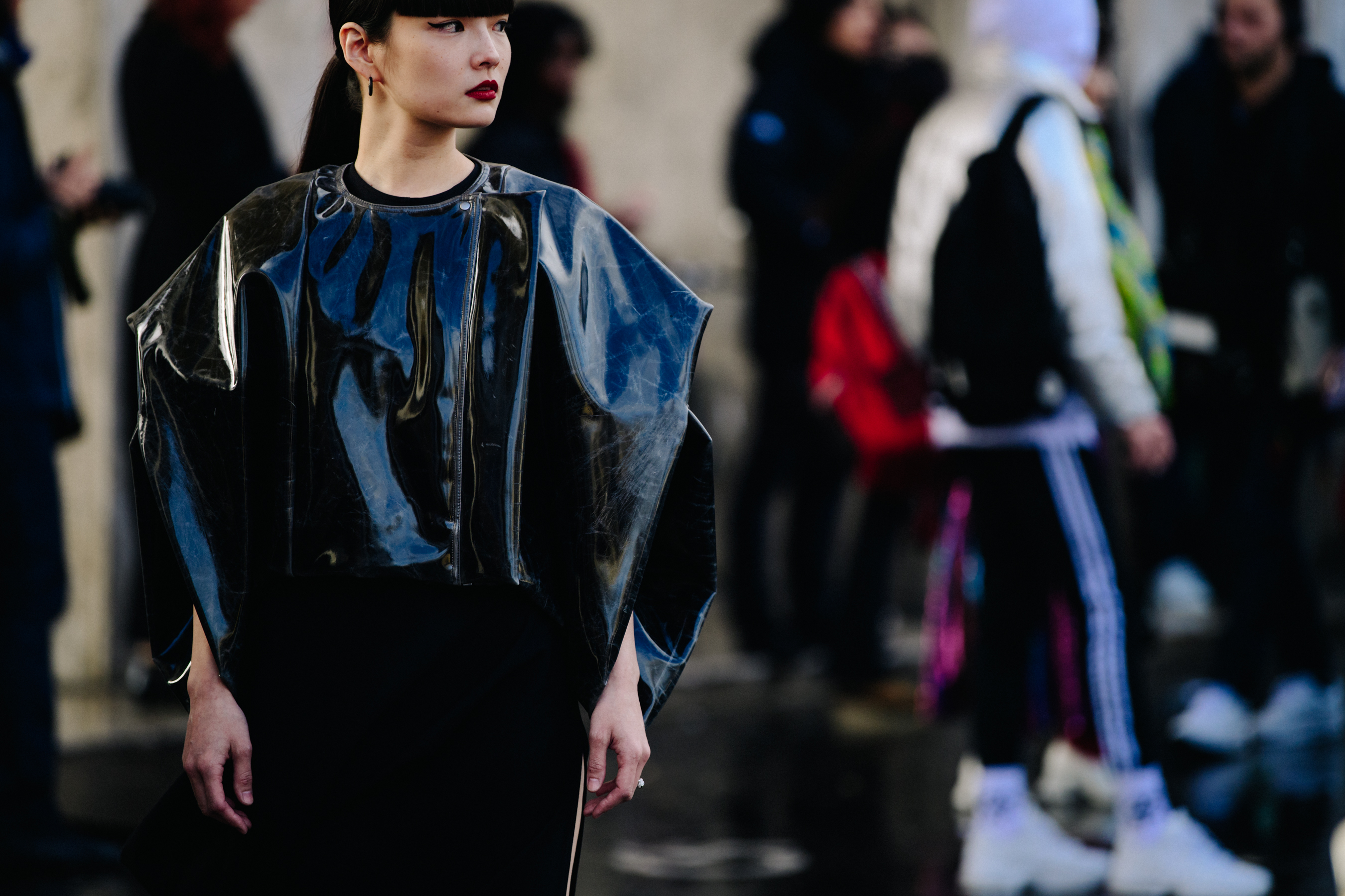 Asian woman wearing plastic jacket