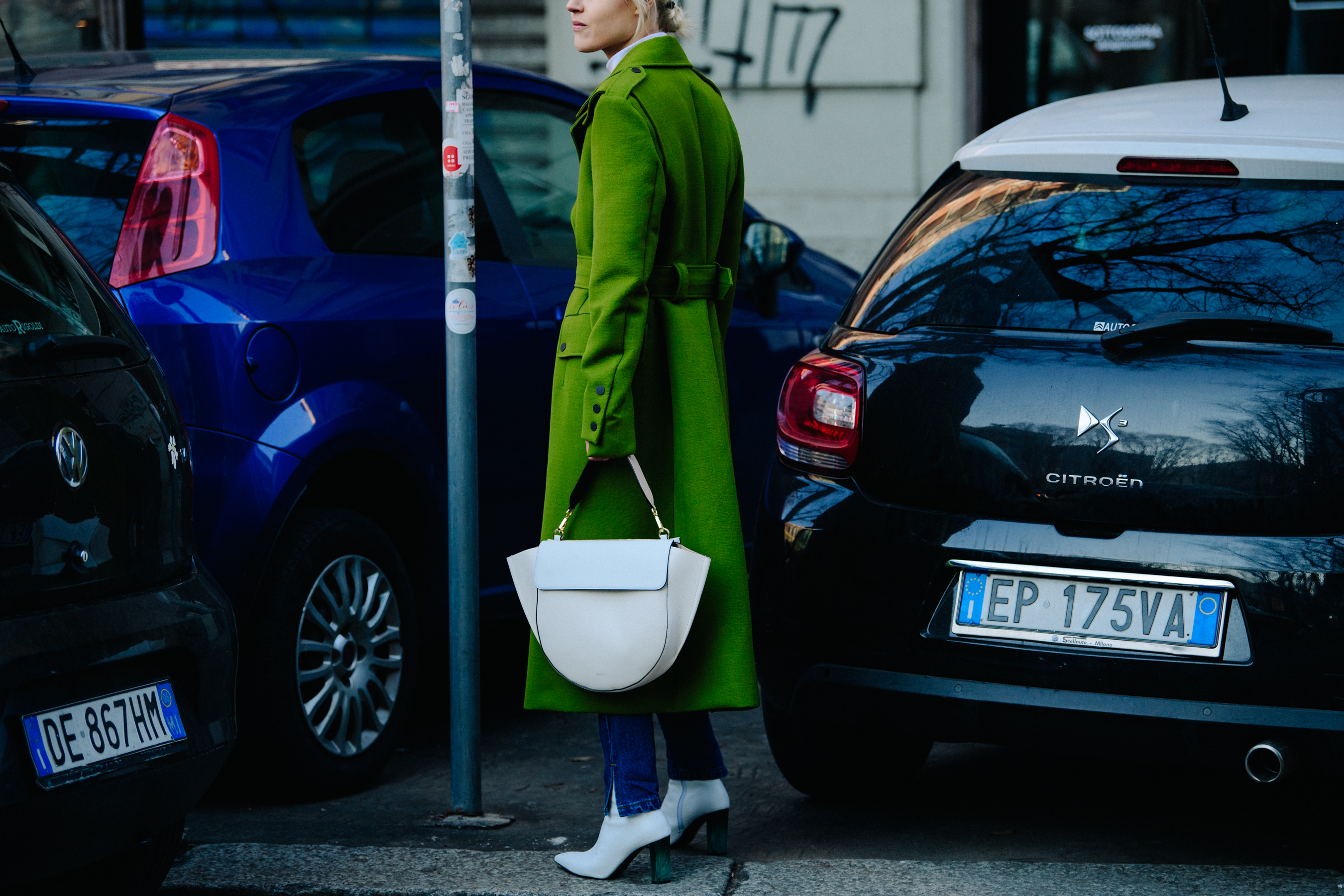 Woman wearing bright green coat