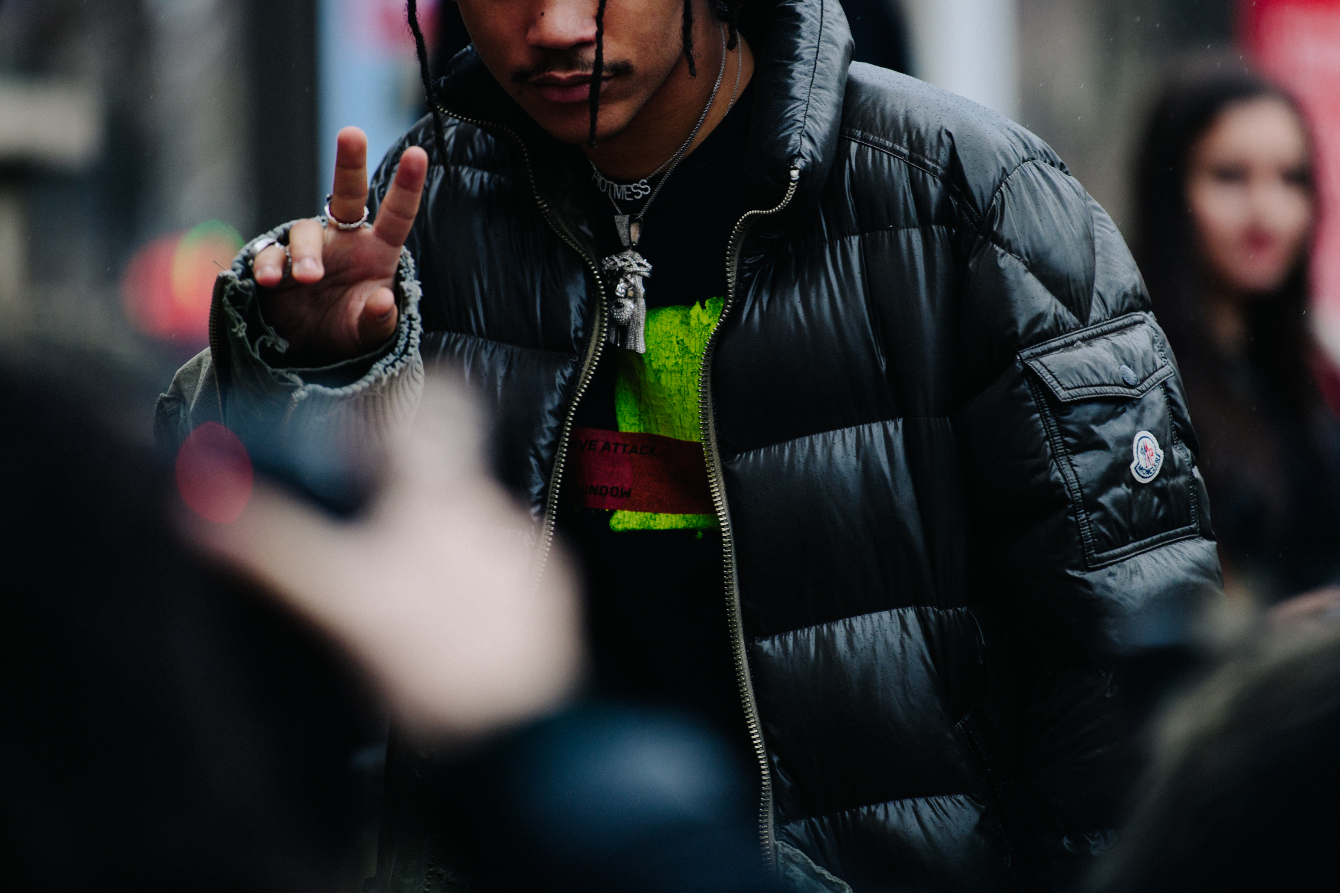 American stylist wearing black Moncler coat