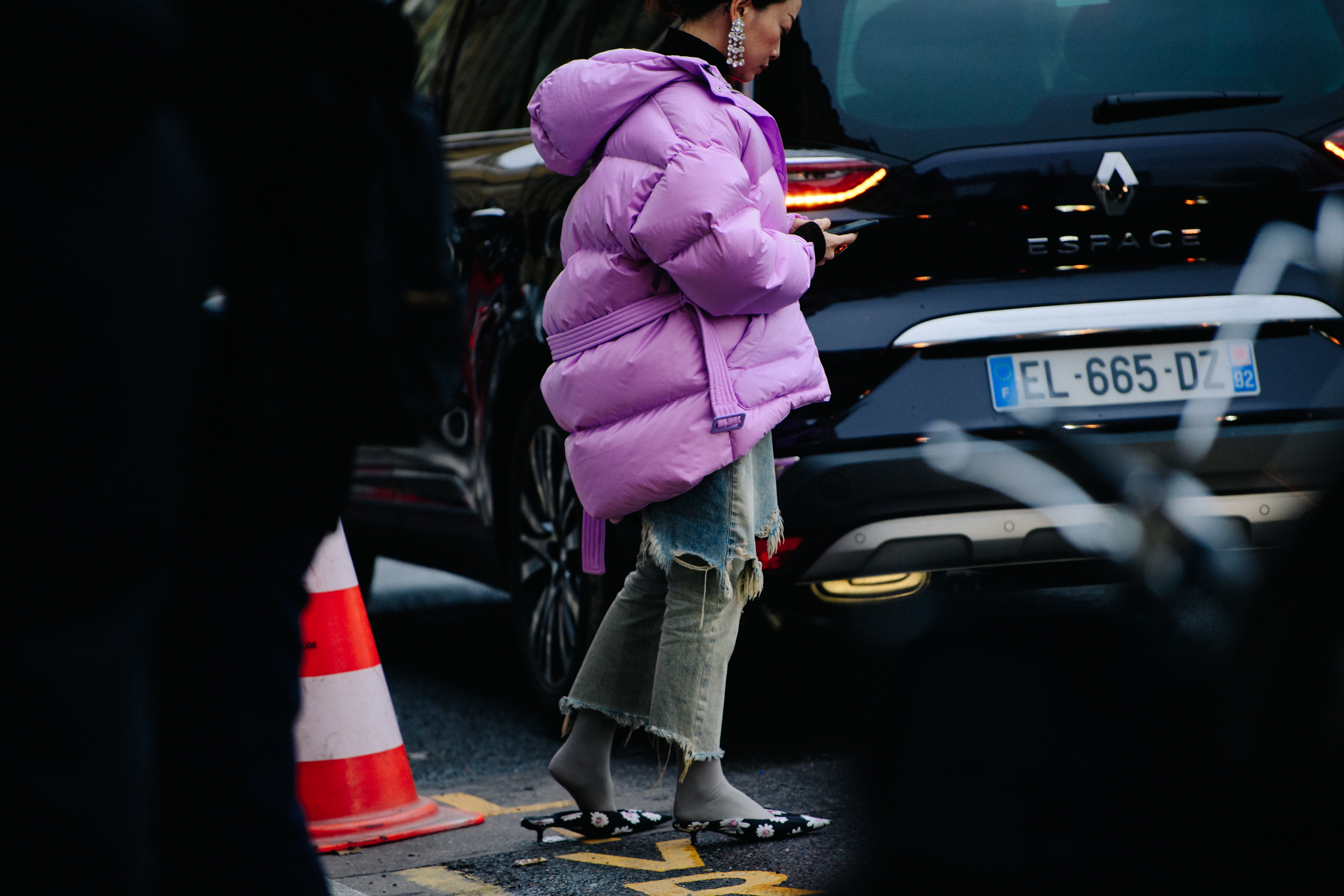 Asian woman wearing purple coat