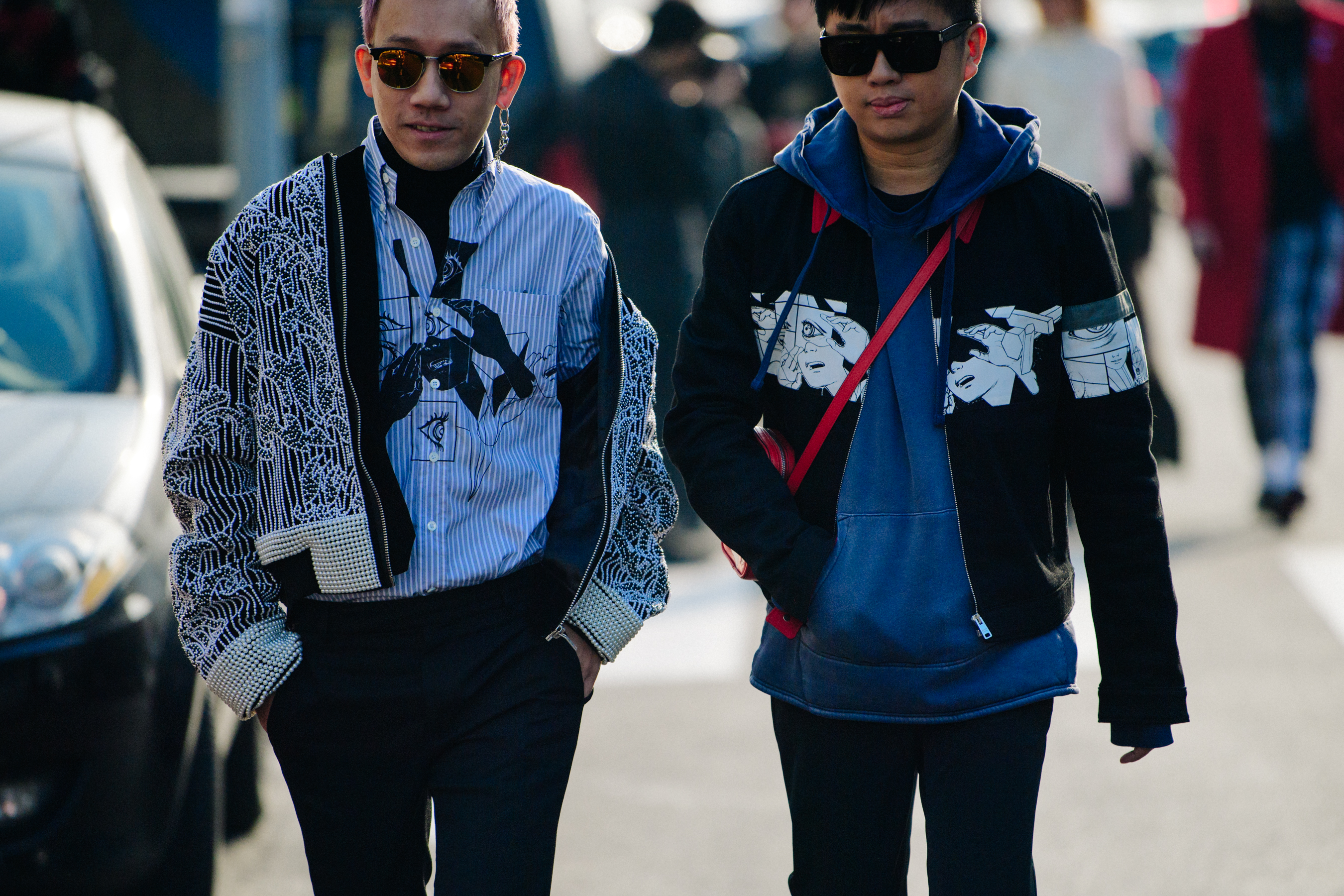 Two Asian men wearing light jackets