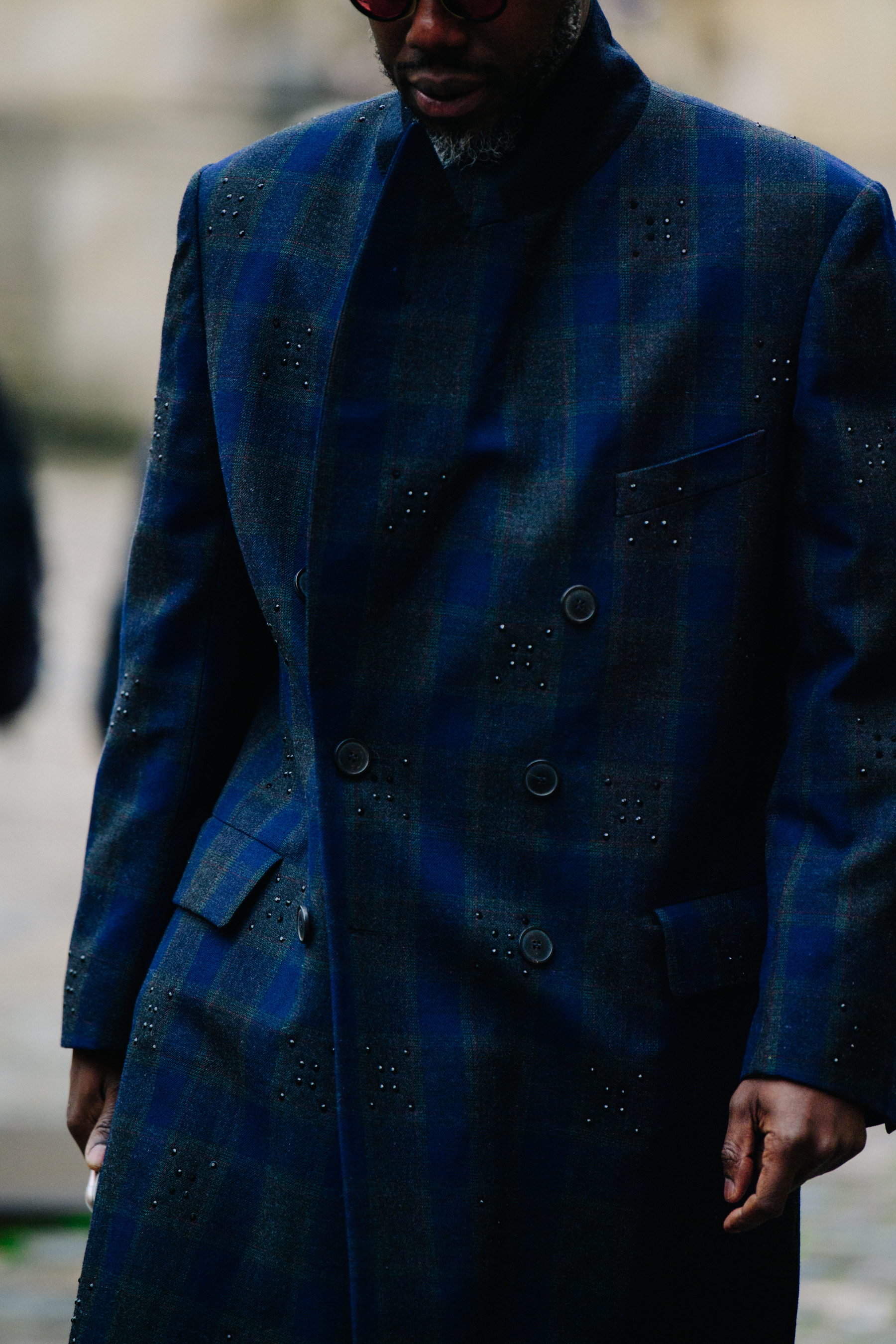 Man wearing detailed blue coat