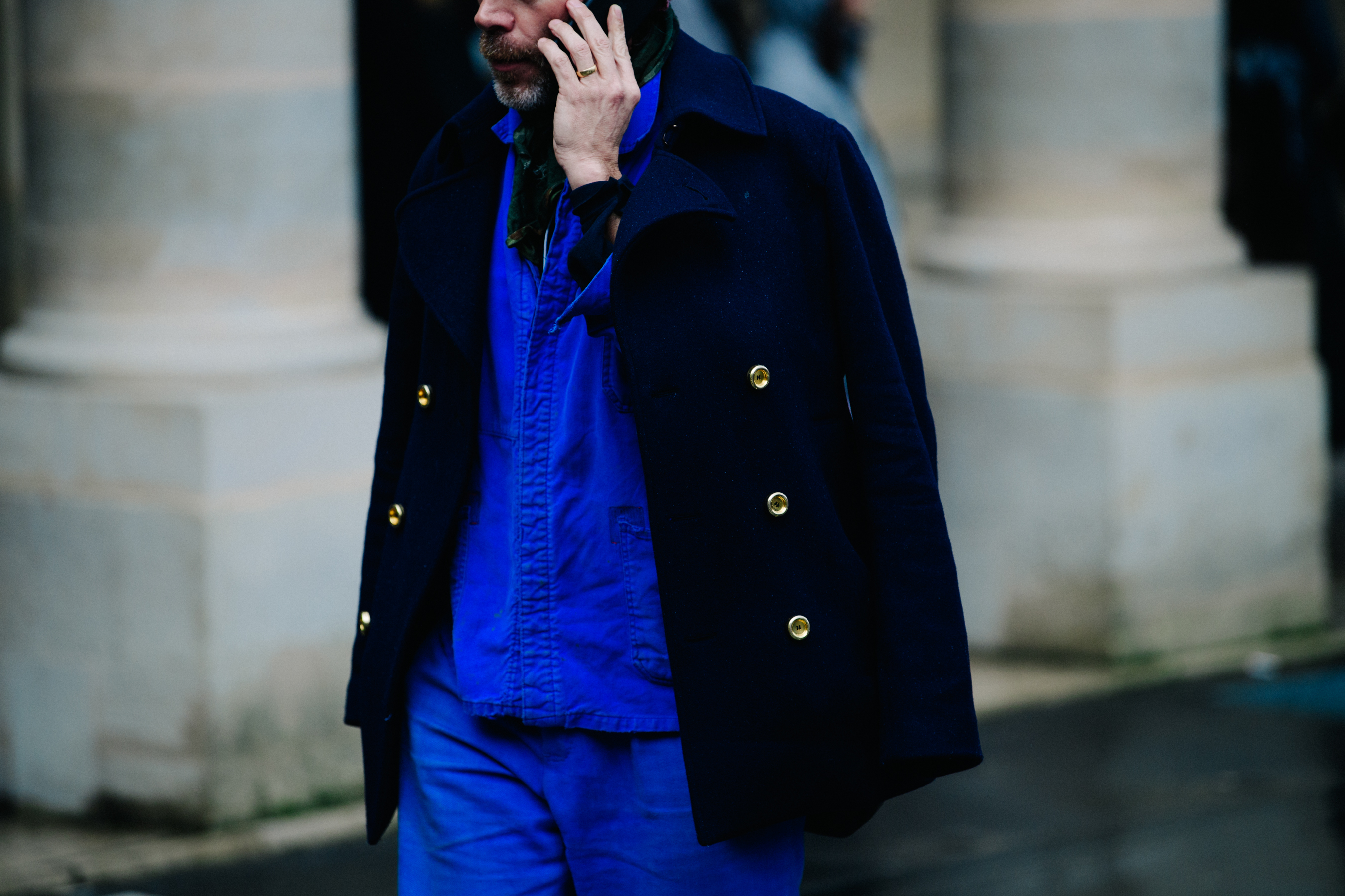 Man wearing blue painters jacket