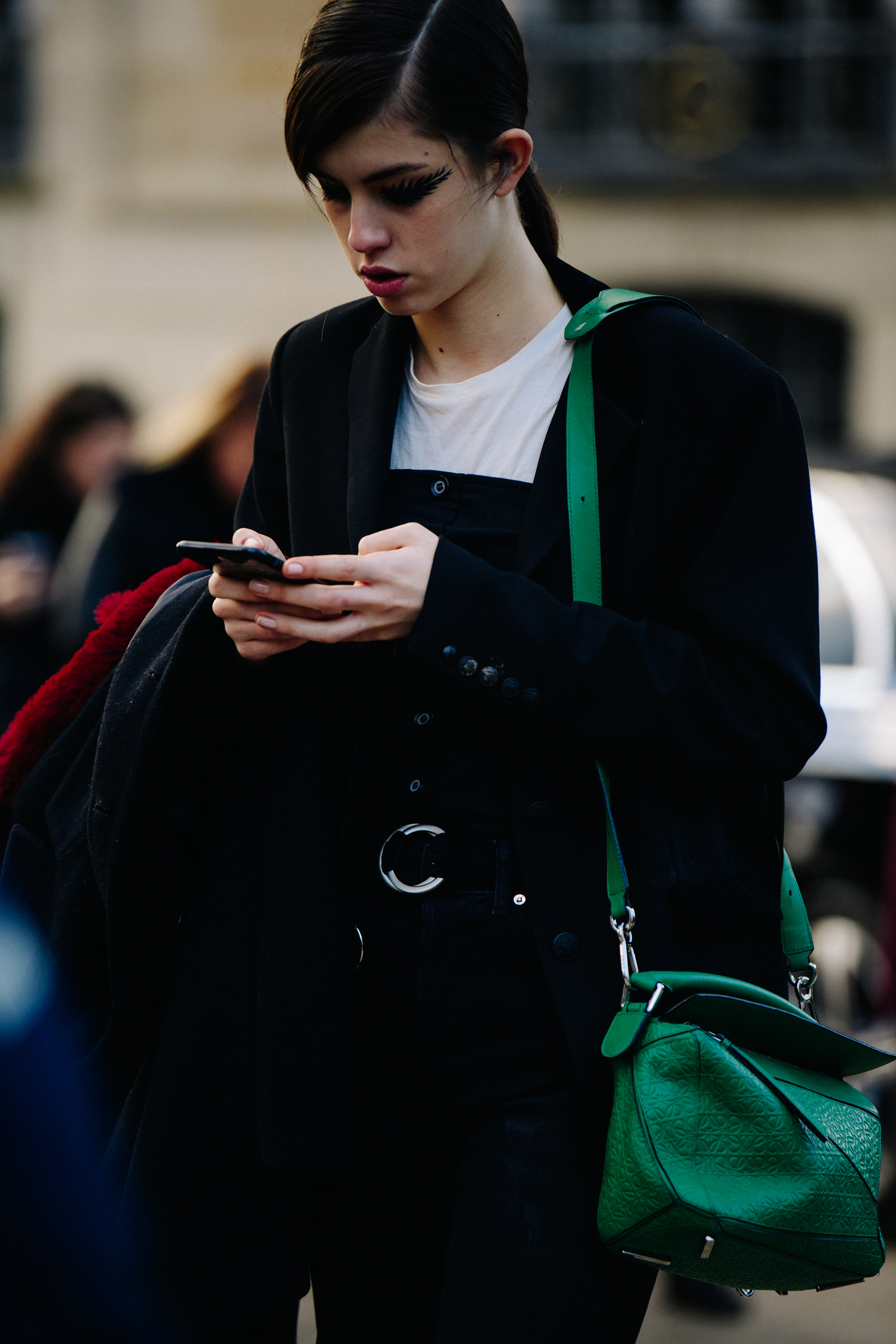 Australian model holding green bag