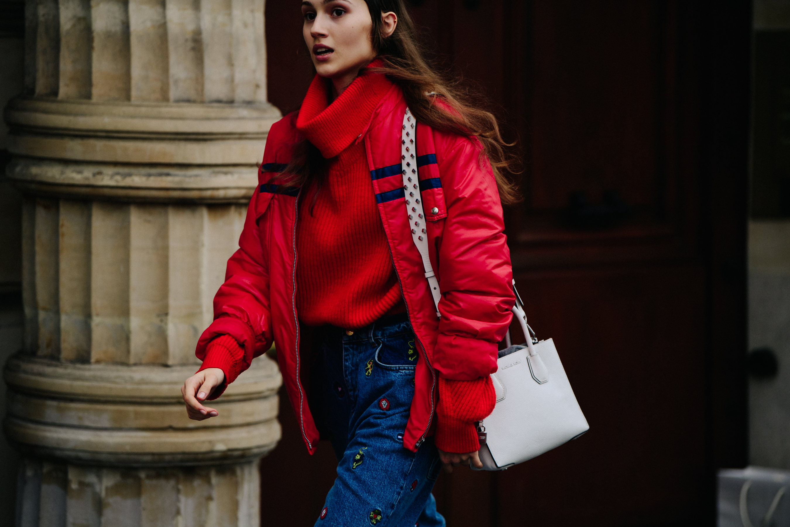 Model wearing red jacket and jumper
