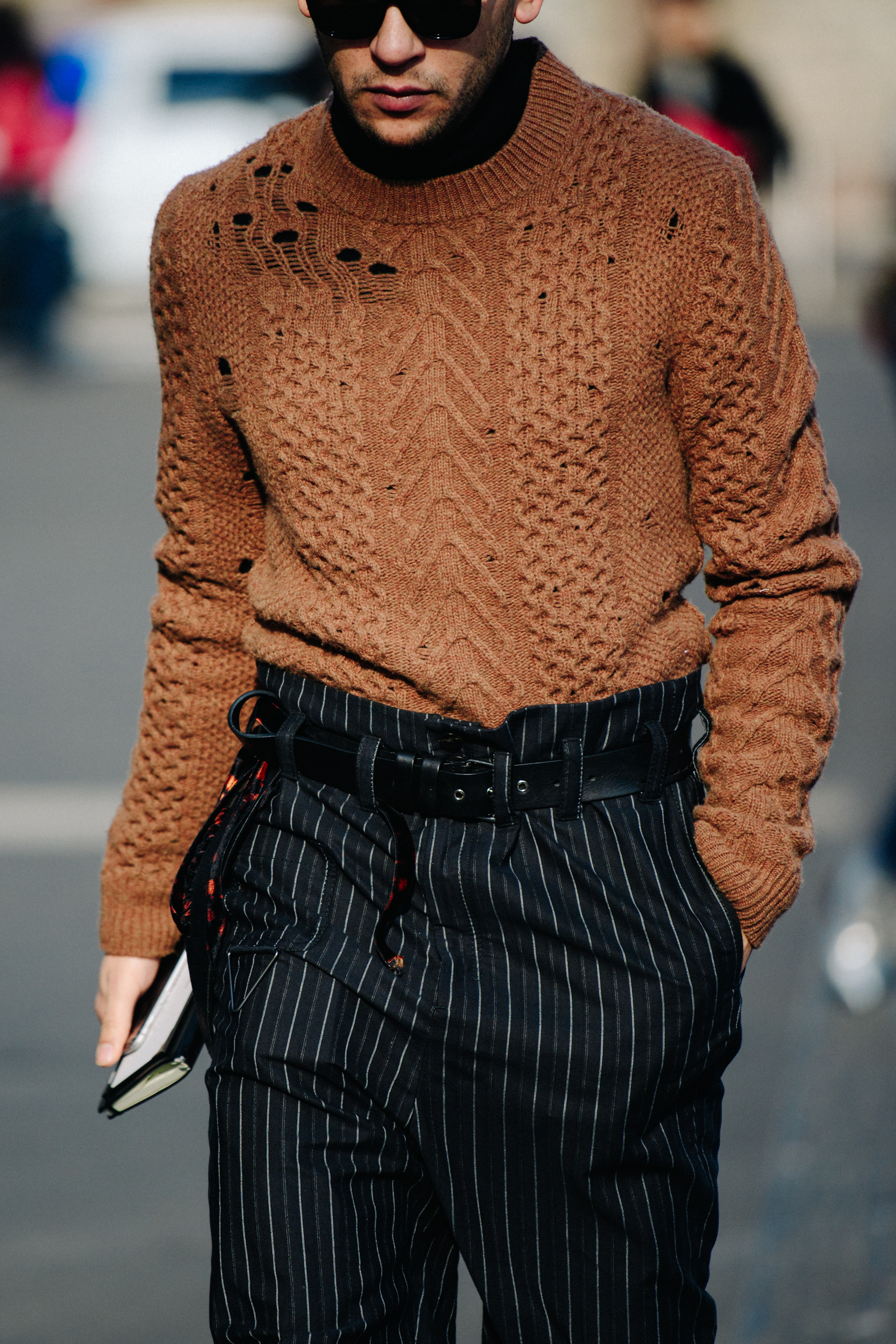 Man wearing brown knitted jumper