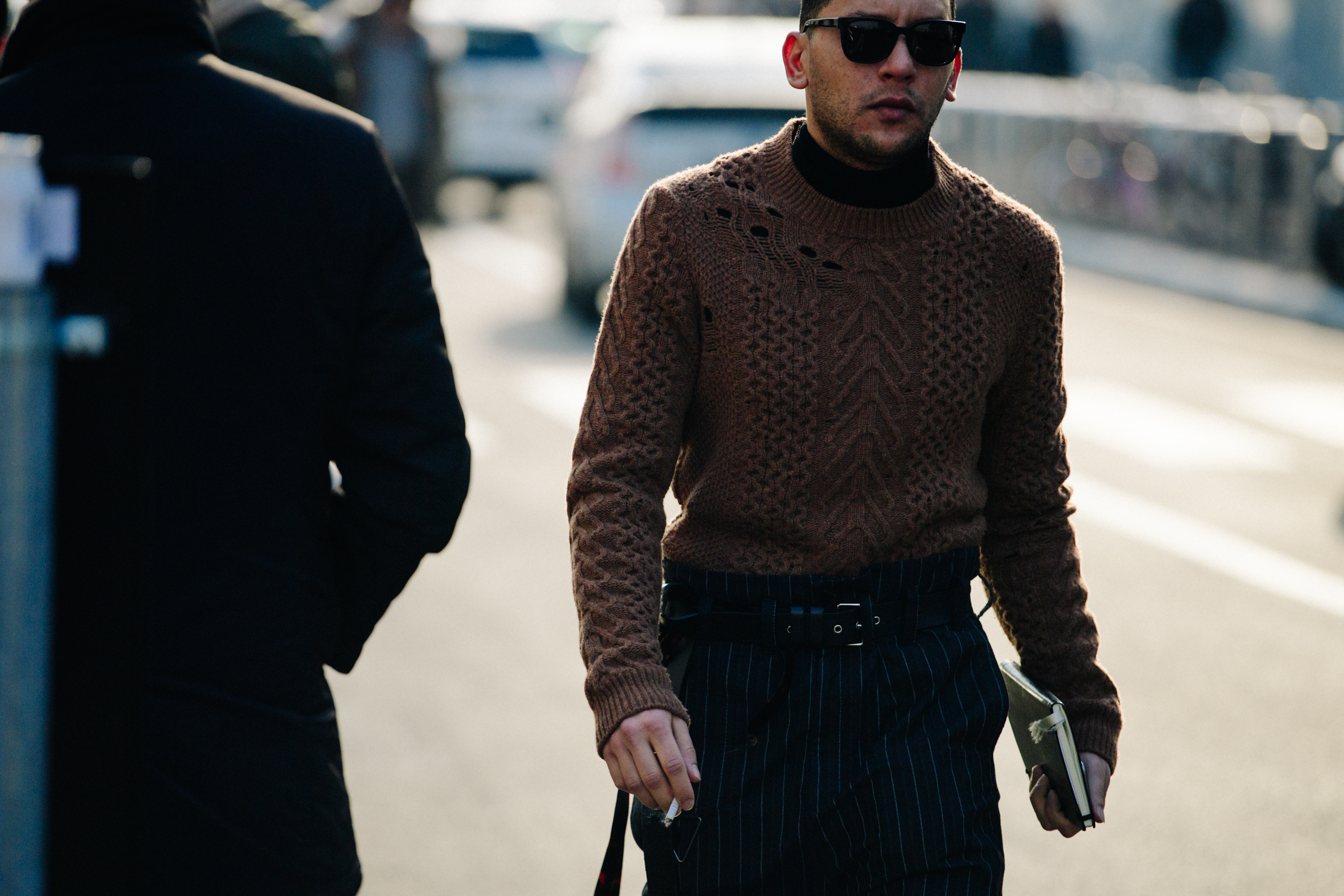 Man wearing distressed brown jumper