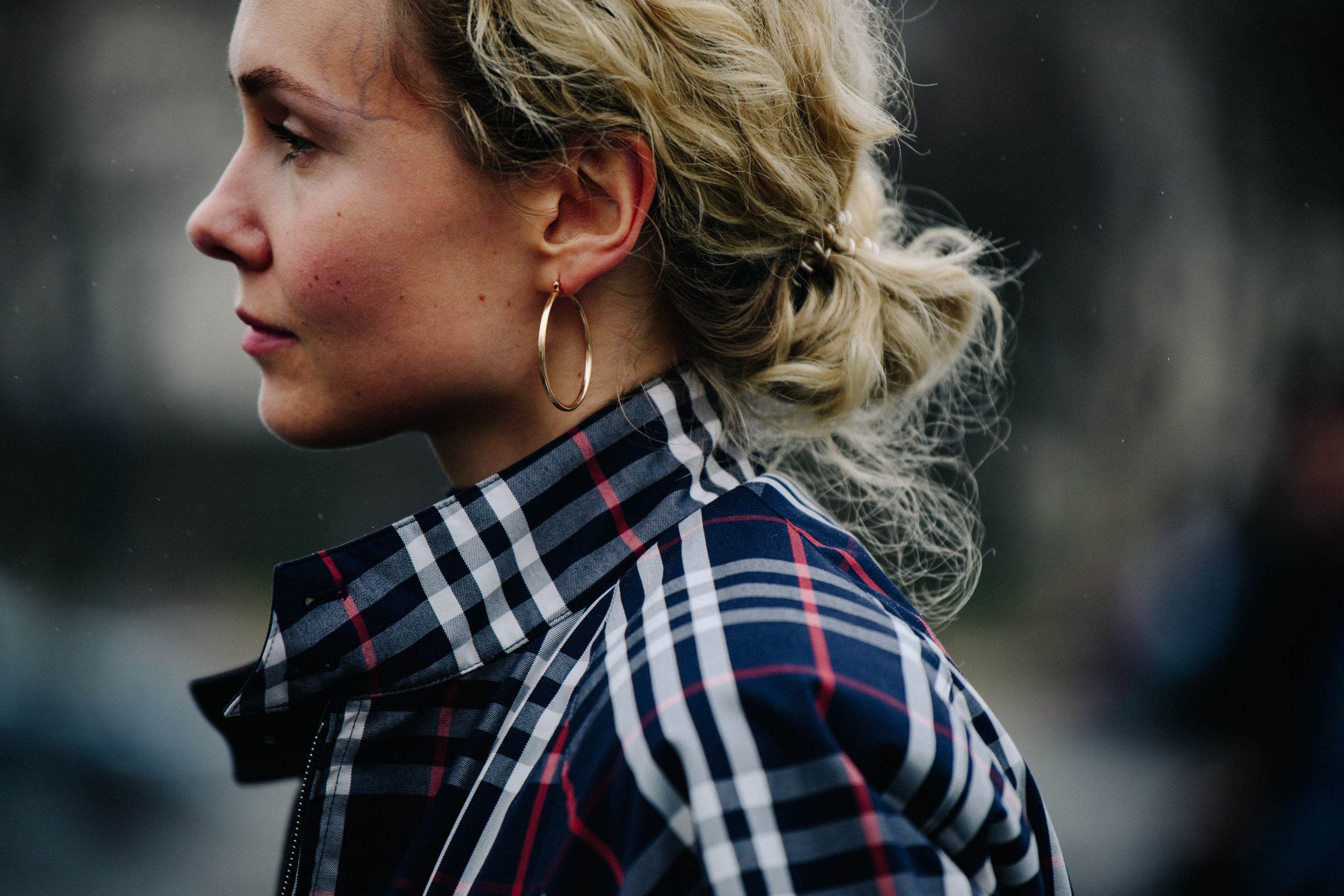 Russian woman wearing gold hoop earrings
