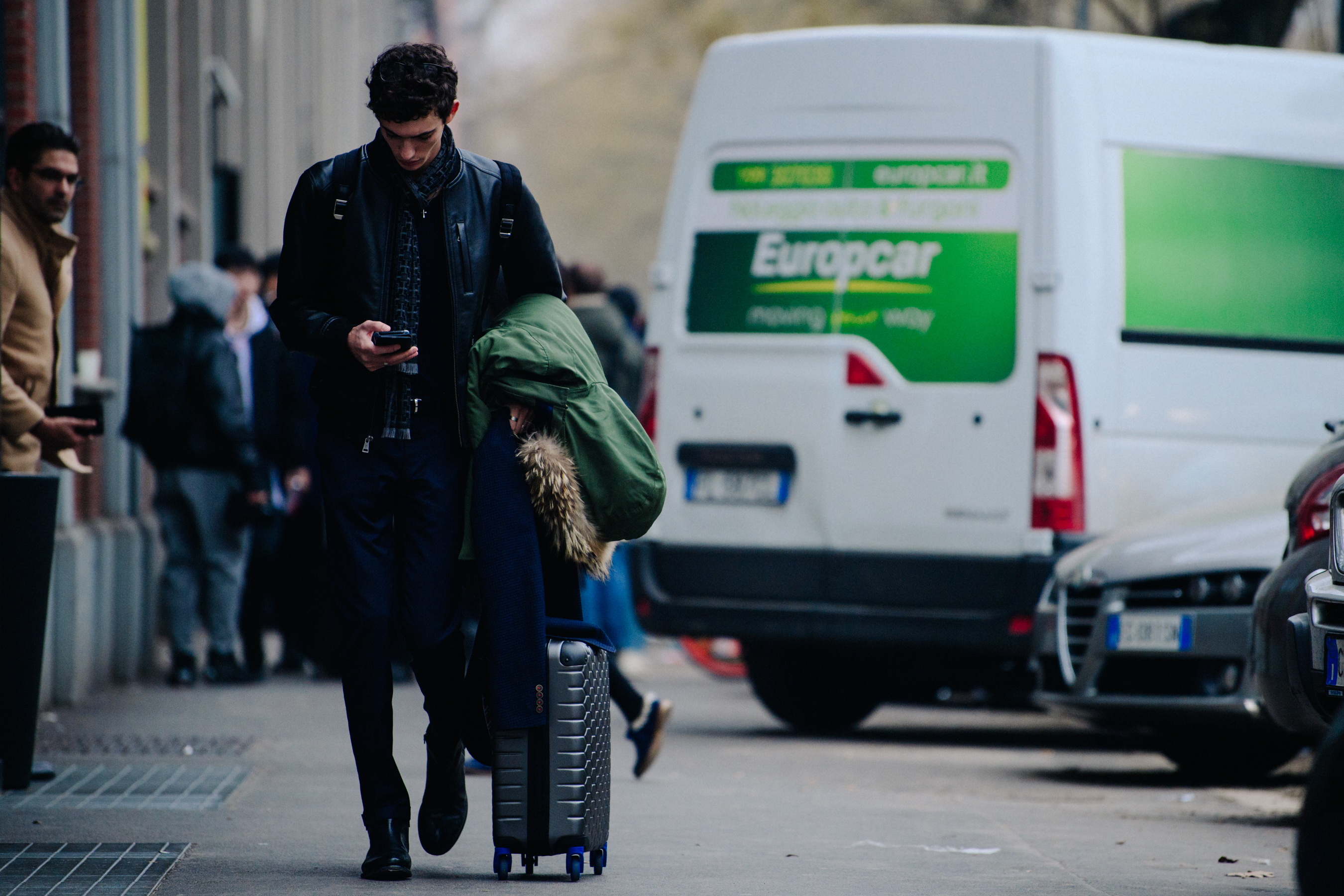 Model leaving show with suitcase